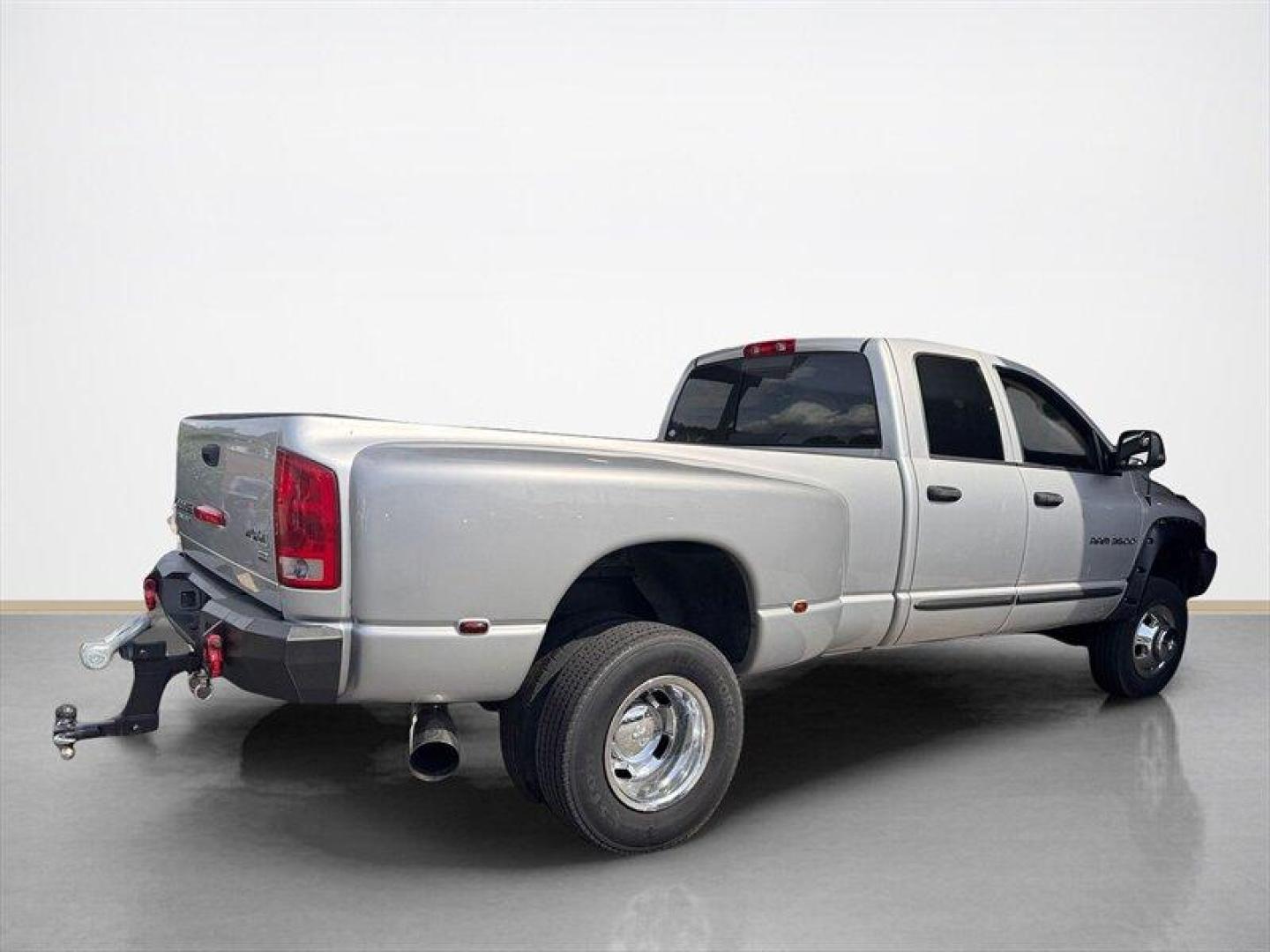 2003 Bright Silver Metallic Clearcoat /Charcoal Dodge Ram 3500 SLT DRW (3D7MU48C23G) with an Cummins 5.9L Diesel Turbo I6 305hp 555ft. lbs. engine, Automatic transmission, located at 25355 Eames Street, Channahon, IL, 60410, (815) 467-1807, 41.429108, -88.228432 - Behold the majestic 2003 Dodge Ram 3500 Quad Cab SLT, a true titan of the road! Powered by the legendary Cummins 5.9L Diesel Turbo I6 engine, this beast roars with 305hp and a jaw-dropping 555ft. lbs. of torque, ready to conquer any challenge that comes its way. Cloaked in a regal Bright Silver Met - Photo#2