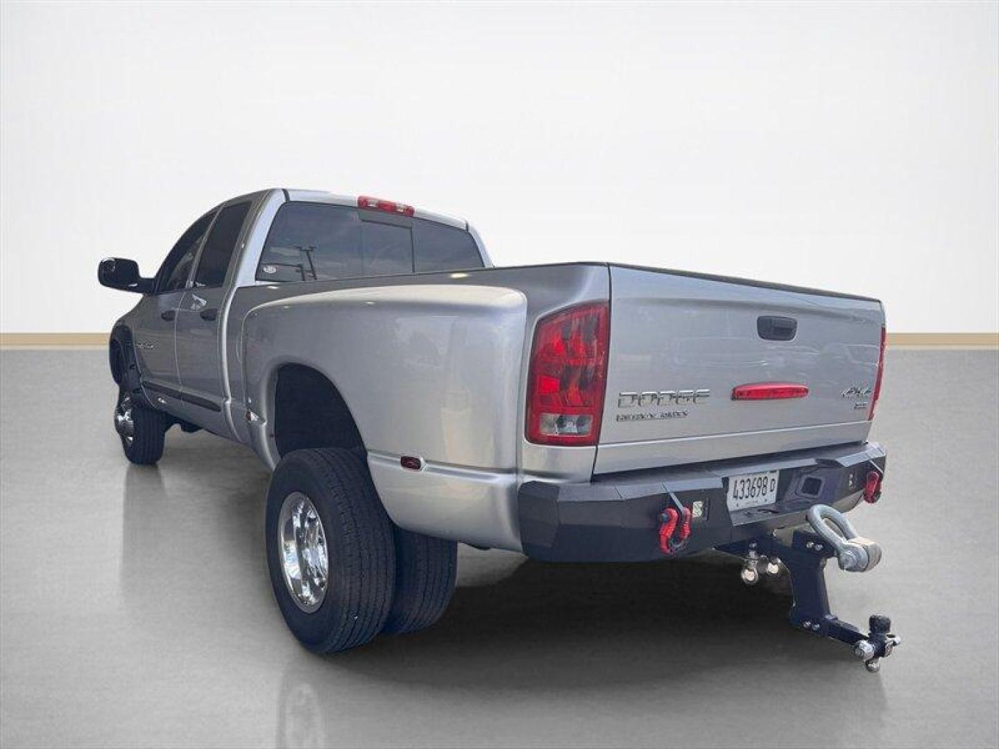 2003 Bright Silver Metallic Clearcoat /Charcoal Dodge Ram 3500 SLT DRW (3D7MU48C23G) with an Cummins 5.9L Diesel Turbo I6 305hp 555ft. lbs. engine, Automatic transmission, located at 25355 Eames Street, Channahon, IL, 60410, (815) 467-1807, 41.429108, -88.228432 - Behold the majestic 2003 Dodge Ram 3500 Quad Cab SLT, a true titan of the road! Powered by the legendary Cummins 5.9L Diesel Turbo I6 engine, this beast roars with 305hp and a jaw-dropping 555ft. lbs. of torque, ready to conquer any challenge that comes its way. Cloaked in a regal Bright Silver Met - Photo#4