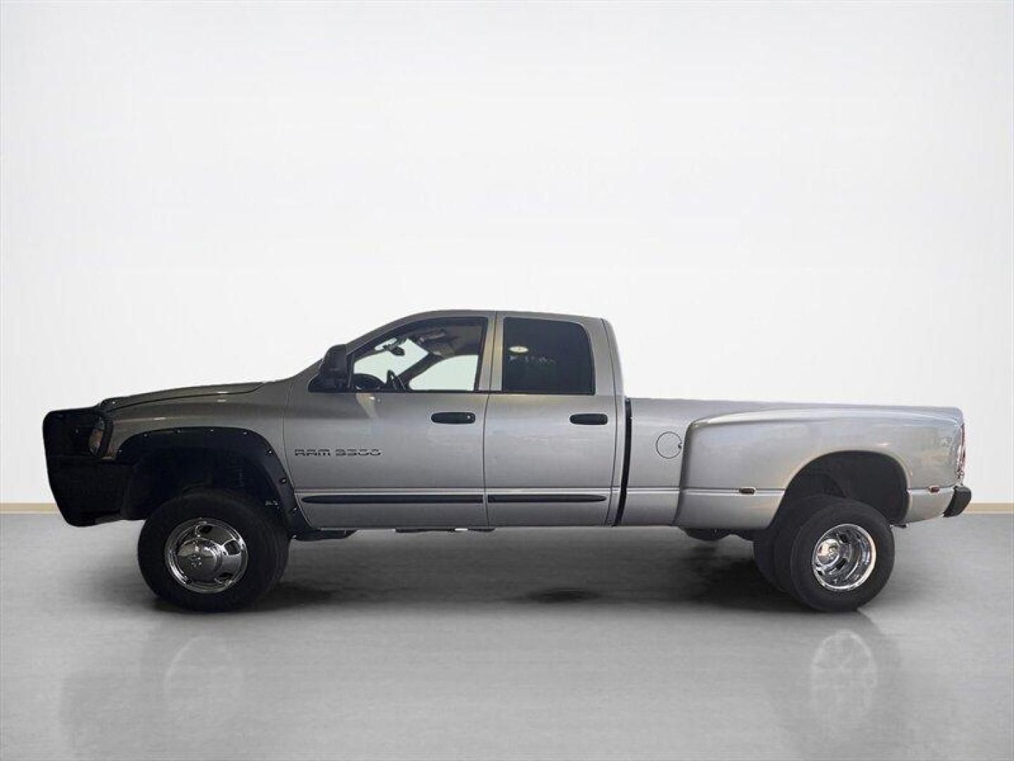 2003 Bright Silver Metallic Clearcoat /Charcoal Dodge Ram 3500 SLT DRW (3D7MU48C23G) with an Cummins 5.9L Diesel Turbo I6 305hp 555ft. lbs. engine, Automatic transmission, located at 25355 Eames Street, Channahon, IL, 60410, (815) 467-1807, 41.429108, -88.228432 - Behold the majestic 2003 Dodge Ram 3500 Quad Cab SLT, a true titan of the road! Powered by the legendary Cummins 5.9L Diesel Turbo I6 engine, this beast roars with 305hp and a jaw-dropping 555ft. lbs. of torque, ready to conquer any challenge that comes its way. Cloaked in a regal Bright Silver Met - Photo#5