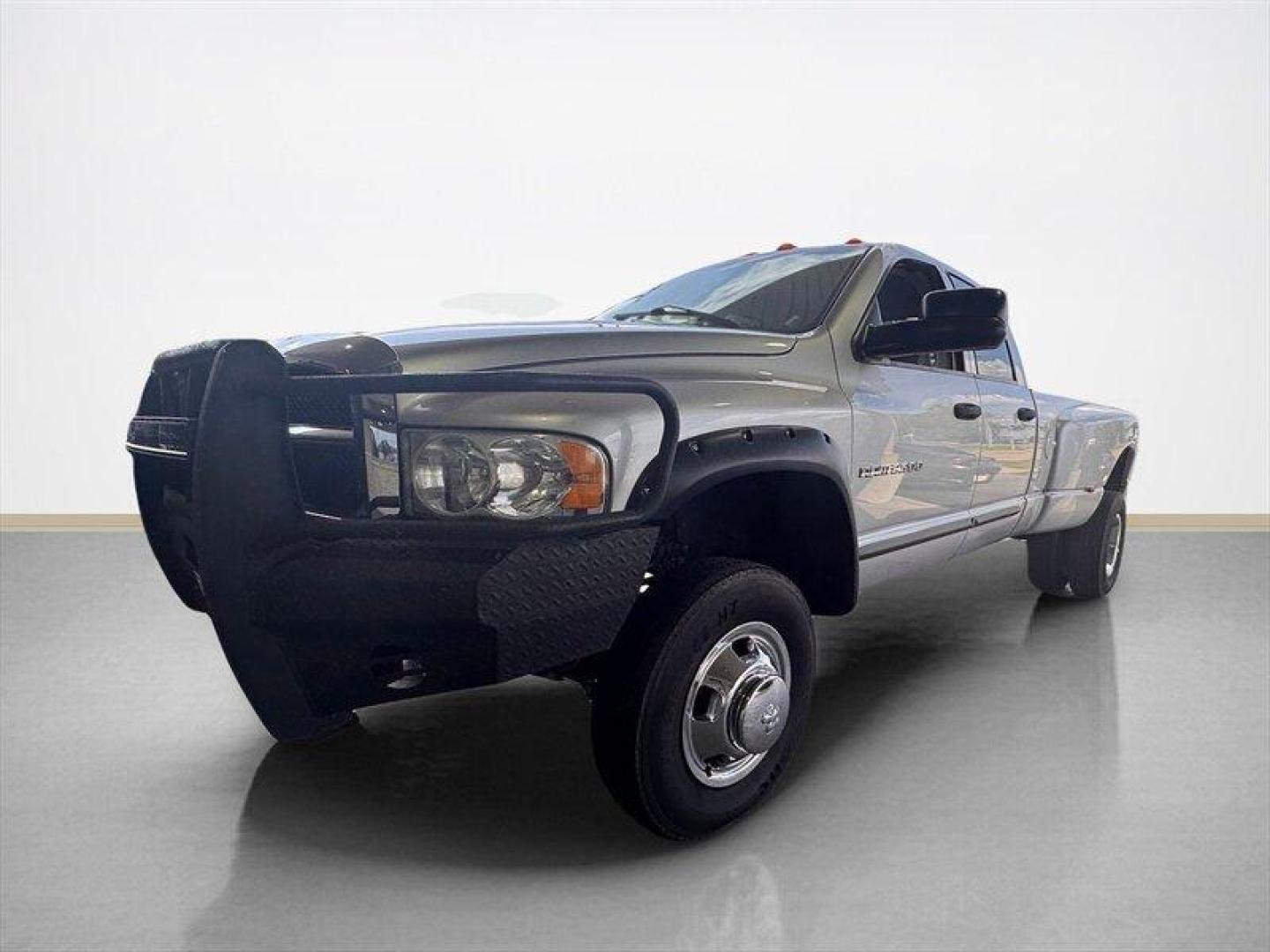 2003 Bright Silver Metallic Clearcoat /Charcoal Dodge Ram 3500 SLT DRW (3D7MU48C23G) with an Cummins 5.9L Diesel Turbo I6 305hp 555ft. lbs. engine, Automatic transmission, located at 25355 Eames Street, Channahon, IL, 60410, (815) 467-1807, 41.429108, -88.228432 - Behold the majestic 2003 Dodge Ram 3500 Quad Cab SLT, a true titan of the road! Powered by the legendary Cummins 5.9L Diesel Turbo I6 engine, this beast roars with 305hp and a jaw-dropping 555ft. lbs. of torque, ready to conquer any challenge that comes its way. Cloaked in a regal Bright Silver Met - Photo#6