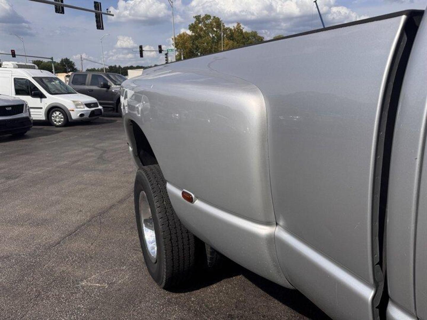 2003 Bright Silver Metallic Clearcoat /Charcoal Dodge Ram 3500 SLT DRW (3D7MU48C23G) with an Cummins 5.9L Diesel Turbo I6 305hp 555ft. lbs. engine, Automatic transmission, located at 25355 Eames Street, Channahon, IL, 60410, (815) 467-1807, 41.429108, -88.228432 - Behold the majestic 2003 Dodge Ram 3500 Quad Cab SLT, a true titan of the road! Powered by the legendary Cummins 5.9L Diesel Turbo I6 engine, this beast roars with 305hp and a jaw-dropping 555ft. lbs. of torque, ready to conquer any challenge that comes its way. Cloaked in a regal Bright Silver Met - Photo#10