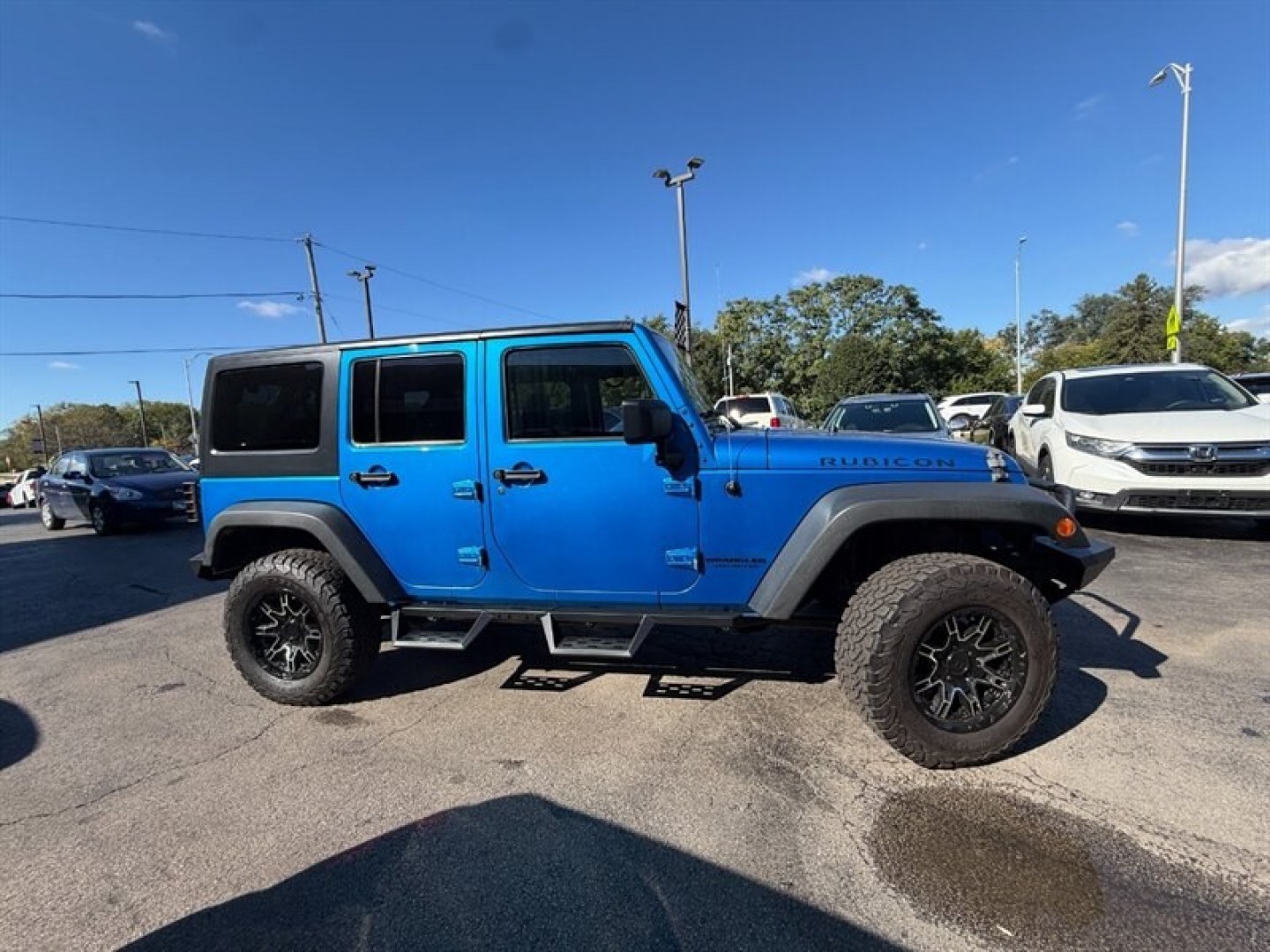 2015 Hydro Blue Pearl Coat Jeep Wrangler Unlimited Rubicon (1C4BJWFG8FL) with an 3.6 engine, Automatic transmission, located at 25355 Eames Street, Channahon, IL, 60410, (815) 467-1807, 41.429108, -88.228432 - Ready to conquer the urban jungle or tackle off-road adventures? Feast your eyes on this 2015 Jeep Wrangler Unlimited Rubicon, dressed to impress in Hydro Blue Pearl Coat because why blend in when you were born to stand out? Under the hood, the fearless 3.6L V6 engine roars to life, delivering ser- Photo#1