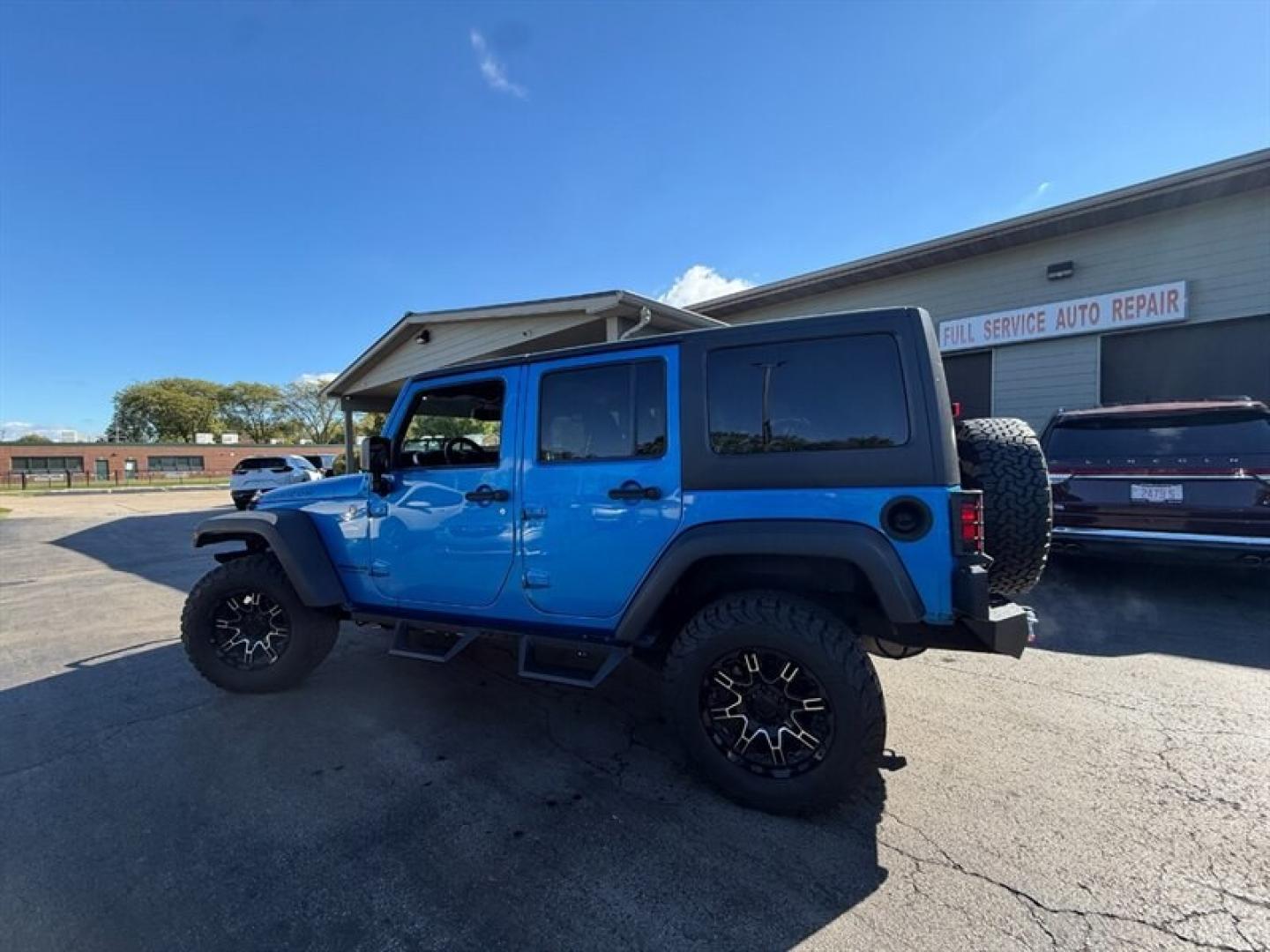 2015 Hydro Blue Pearl Coat Jeep Wrangler Unlimited Rubicon (1C4BJWFG8FL) with an 3.6 engine, Automatic transmission, located at 25355 Eames Street, Channahon, IL, 60410, (815) 467-1807, 41.429108, -88.228432 - Ready to conquer the urban jungle or tackle off-road adventures? Feast your eyes on this 2015 Jeep Wrangler Unlimited Rubicon, dressed to impress in Hydro Blue Pearl Coat because why blend in when you were born to stand out? Under the hood, the fearless 3.6L V6 engine roars to life, delivering ser- Photo#4