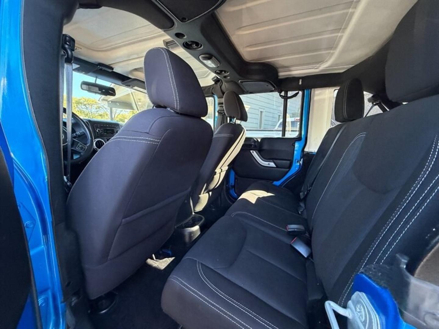 2015 Hydro Blue Pearl Coat Jeep Wrangler Unlimited Rubicon (1C4BJWFG8FL) with an 3.6 engine, Automatic transmission, located at 25355 Eames Street, Channahon, IL, 60410, (815) 467-1807, 41.429108, -88.228432 - Ready to conquer the urban jungle or tackle off-road adventures? Feast your eyes on this 2015 Jeep Wrangler Unlimited Rubicon, dressed to impress in Hydro Blue Pearl Coat because why blend in when you were born to stand out? Under the hood, the fearless 3.6L V6 engine roars to life, delivering ser- Photo#9