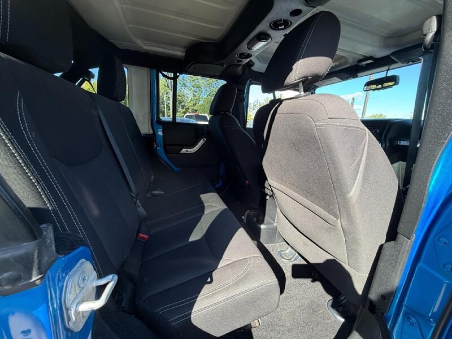 2015 Hydro Blue Pearl Coat Jeep Wrangler Unlimited Rubicon (1C4BJWFG8FL) with an 3.6 engine, Automatic transmission, located at 25355 Eames Street, Channahon, IL, 60410, (815) 467-1807, 41.429108, -88.228432 - Ready to conquer the urban jungle or tackle off-road adventures? Feast your eyes on this 2015 Jeep Wrangler Unlimited Rubicon, dressed to impress in Hydro Blue Pearl Coat because why blend in when you were born to stand out? Under the hood, the fearless 3.6L V6 engine roars to life, delivering ser- Photo#11