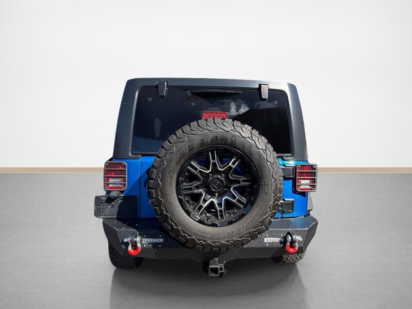 2015 Hydro Blue Pearl Coat Jeep Wrangler Unlimited Unlimited Rubicon (1C4BJWFG8FL) with an 3.6L V6 285hp 260ft. lbs. engine, Automatic transmission, located at 25355 Eames Street, Channahon, IL, 60410, (815) 467-1807, 41.429108, -88.228432 - Ready to conquer the concrete jungle *and* the off-road trails? Feast your eyes on this 2015 Jeep Wrangler Unlimited Rubicon in a show-stopping Hydro Blue Pearl Coat that screams adventure with a splash of style. Under the hood? A beastly 3.6L V6 engine flexing 285 horsepower and 260 lb-ft of torque- Photo#3
