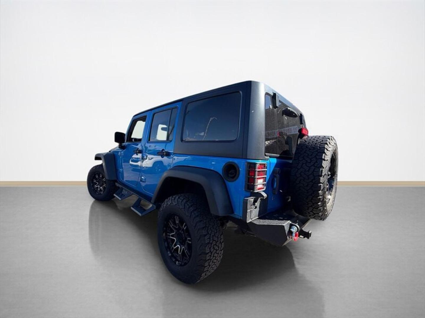 2015 Hydro Blue Pearl Coat Jeep Wrangler Unlimited Unlimited Rubicon (1C4BJWFG8FL) with an 3.6L V6 285hp 260ft. lbs. engine, Automatic transmission, located at 25355 Eames Street, Channahon, IL, 60410, (815) 467-1807, 41.429108, -88.228432 - Ready to conquer the concrete jungle *and* the off-road trails? Feast your eyes on this 2015 Jeep Wrangler Unlimited Rubicon in a show-stopping Hydro Blue Pearl Coat that screams adventure with a splash of style. Under the hood? A beastly 3.6L V6 engine flexing 285 horsepower and 260 lb-ft of torque- Photo#4