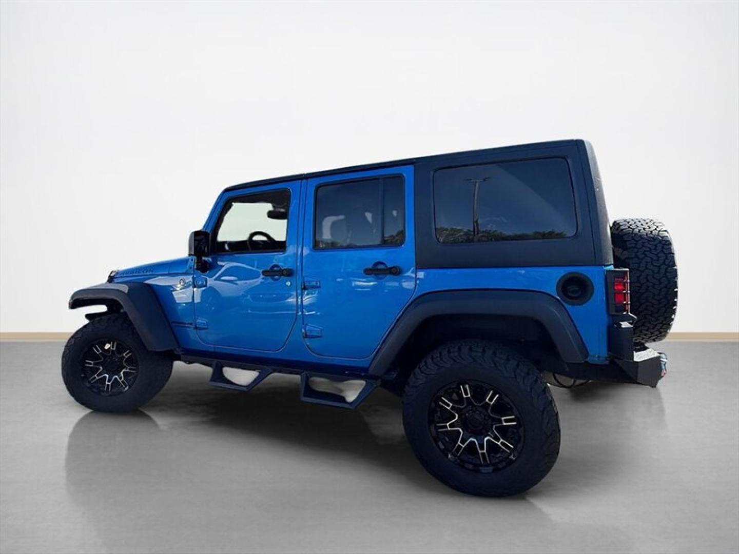 2015 Hydro Blue Pearl Coat Jeep Wrangler Unlimited Unlimited Rubicon (1C4BJWFG8FL) with an 3.6L V6 285hp 260ft. lbs. engine, Automatic transmission, located at 25355 Eames Street, Channahon, IL, 60410, (815) 467-1807, 41.429108, -88.228432 - Ready to conquer the concrete jungle *and* the off-road trails? Feast your eyes on this 2015 Jeep Wrangler Unlimited Rubicon in a show-stopping Hydro Blue Pearl Coat that screams adventure with a splash of style. Under the hood? A beastly 3.6L V6 engine flexing 285 horsepower and 260 lb-ft of torque- Photo#5