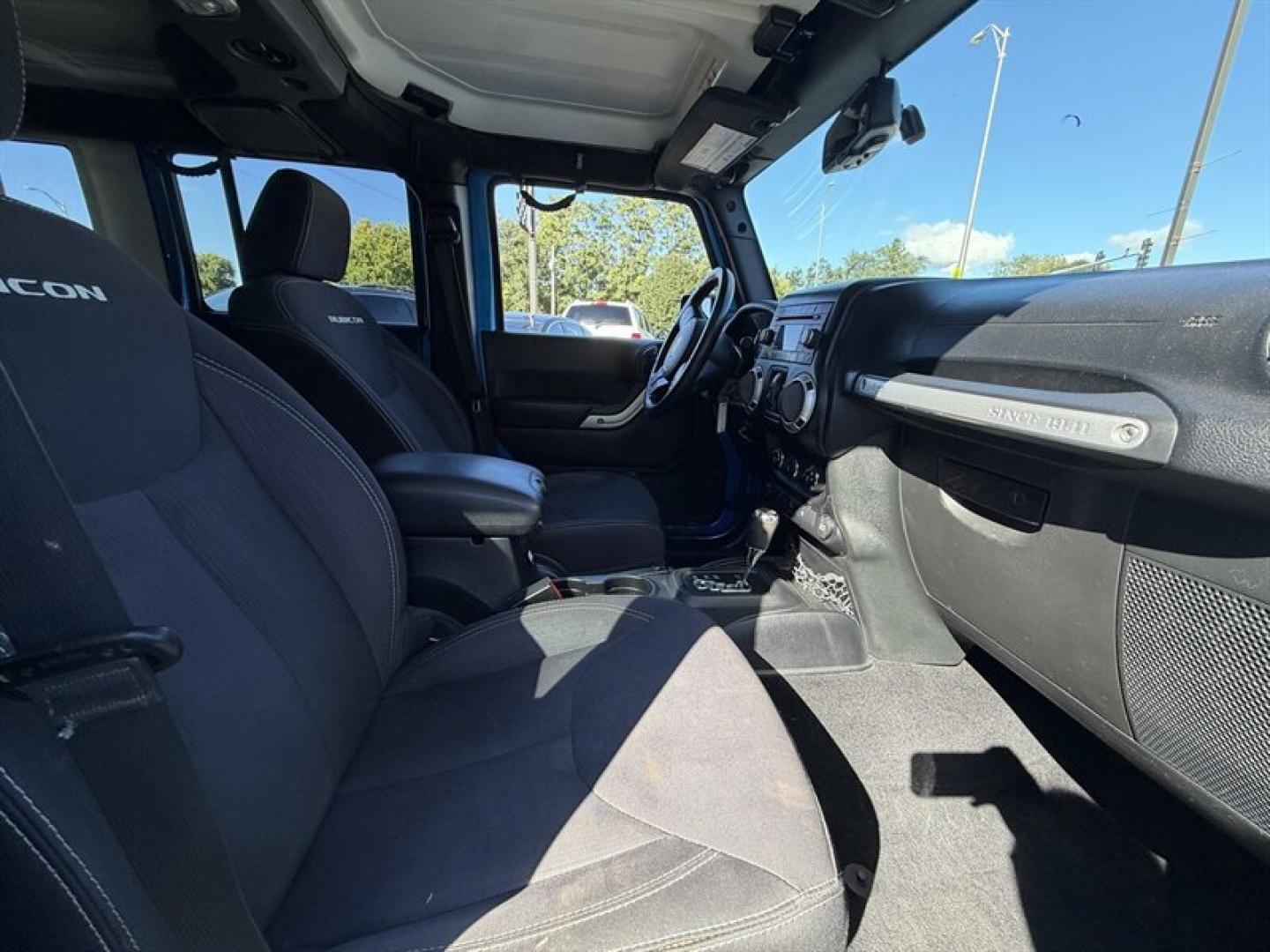 2015 Hydro Blue Pearl Coat Jeep Wrangler Unlimited Unlimited Rubicon (1C4BJWFG8FL) with an 3.6L V6 285hp 260ft. lbs. engine, Automatic transmission, located at 25355 Eames Street, Channahon, IL, 60410, (815) 467-1807, 41.429108, -88.228432 - Ready to conquer the concrete jungle *and* the off-road trails? Feast your eyes on this 2015 Jeep Wrangler Unlimited Rubicon in a show-stopping Hydro Blue Pearl Coat that screams adventure with a splash of style. Under the hood? A beastly 3.6L V6 engine flexing 285 horsepower and 260 lb-ft of torque- Photo#10