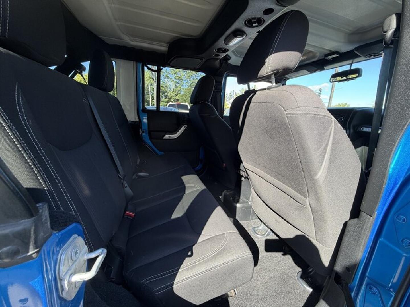 2015 Hydro Blue Pearl Coat Jeep Wrangler Unlimited Unlimited Rubicon (1C4BJWFG8FL) with an 3.6L V6 285hp 260ft. lbs. engine, Automatic transmission, located at 25355 Eames Street, Channahon, IL, 60410, (815) 467-1807, 41.429108, -88.228432 - Ready to conquer the concrete jungle *and* the off-road trails? Feast your eyes on this 2015 Jeep Wrangler Unlimited Rubicon in a show-stopping Hydro Blue Pearl Coat that screams adventure with a splash of style. Under the hood? A beastly 3.6L V6 engine flexing 285 horsepower and 260 lb-ft of torque- Photo#11