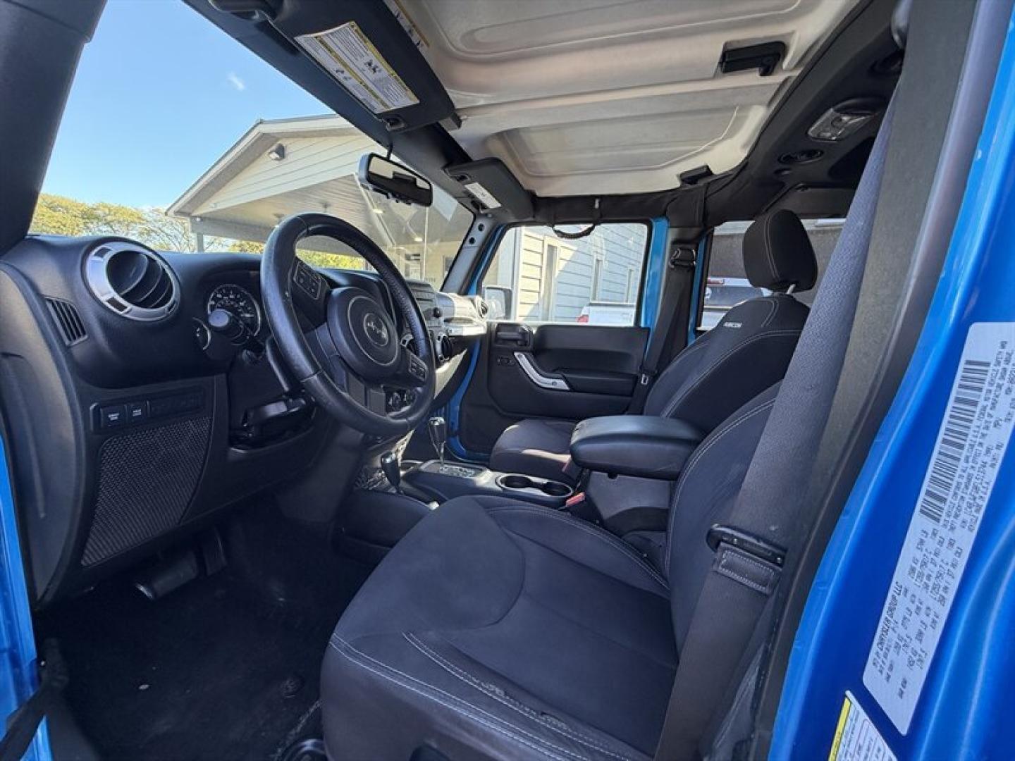 2015 Hydro Blue Pearl Coat Jeep Wrangler Unlimited Unlimited Rubicon (1C4BJWFG8FL) with an 3.6L V6 285hp 260ft. lbs. engine, Automatic transmission, located at 25355 Eames Street, Channahon, IL, 60410, (815) 467-1807, 41.429108, -88.228432 - Ready to conquer the concrete jungle *and* the off-road trails? Feast your eyes on this 2015 Jeep Wrangler Unlimited Rubicon in a show-stopping Hydro Blue Pearl Coat that screams adventure with a splash of style. Under the hood? A beastly 3.6L V6 engine flexing 285 horsepower and 260 lb-ft of torque- Photo#14