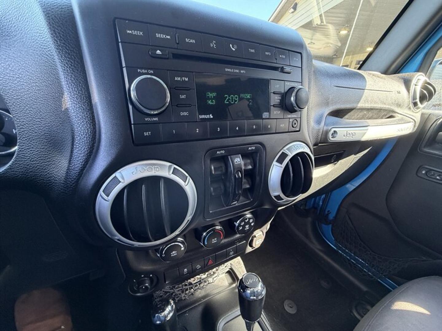 2015 Hydro Blue Pearl Coat Jeep Wrangler Unlimited Unlimited Rubicon (1C4BJWFG8FL) with an 3.6L V6 285hp 260ft. lbs. engine, Automatic transmission, located at 25355 Eames Street, Channahon, IL, 60410, (815) 467-1807, 41.429108, -88.228432 - Ready to conquer the concrete jungle *and* the off-road trails? Feast your eyes on this 2015 Jeep Wrangler Unlimited Rubicon in a show-stopping Hydro Blue Pearl Coat that screams adventure with a splash of style. Under the hood? A beastly 3.6L V6 engine flexing 285 horsepower and 260 lb-ft of torque- Photo#15