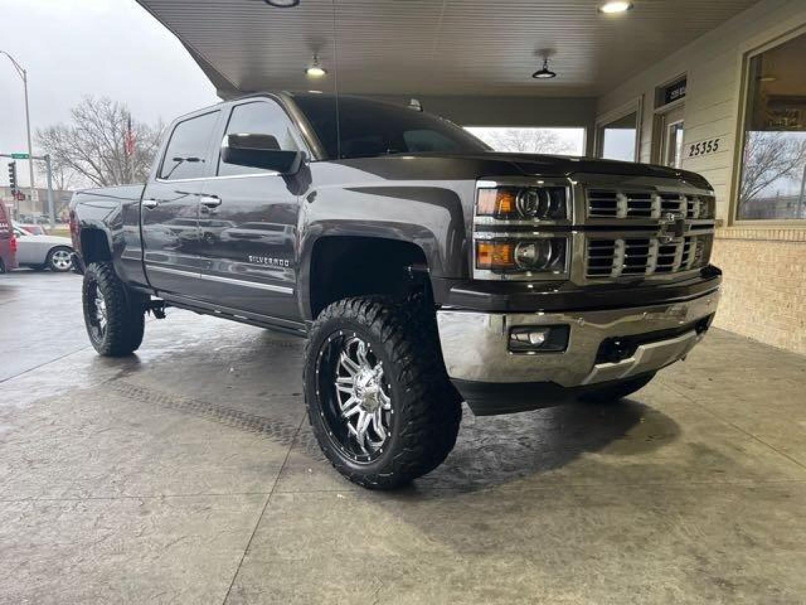 2015 Tungsten Metallic Chevrolet Silverado 1500 LTZ Crew Cab (3GCPCSEC1FG) with an EcoTec3 5.3L V8 355hp 383ft. lbs. engine, Automatic transmission, located at 25355 Eames Street, Channahon, IL, 60410, (815) 467-1807, 41.429108, -88.228432 - CLEAN LOW MILE LTZ Z71! HEATED AND COOLED LEATHER! NAVI! BACK UP CAMERA! REMOTE START! LIFTED WITH AFTERMARKET RIMS AND POWER BOARDS! Auto, all power, tilt, cruise, a/c, alloy wheels, keyless entry and more! If youre ready for a different, no hassle and pleasant car buying experience, then give us a - Photo #0