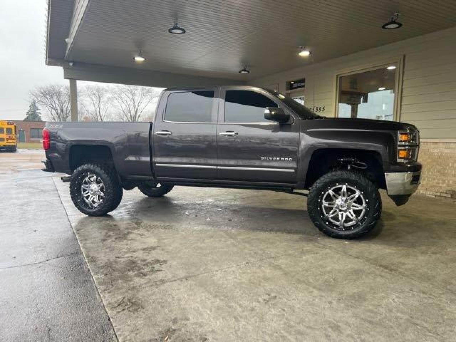2015 Tungsten Metallic Chevrolet Silverado 1500 LTZ Crew Cab (3GCPCSEC1FG) with an EcoTec3 5.3L V8 355hp 383ft. lbs. engine, Automatic transmission, located at 25355 Eames Street, Channahon, IL, 60410, (815) 467-1807, 41.429108, -88.228432 - CLEAN LOW MILE LTZ Z71! HEATED AND COOLED LEATHER! NAVI! BACK UP CAMERA! REMOTE START! LIFTED WITH AFTERMARKET RIMS AND POWER BOARDS! Auto, all power, tilt, cruise, a/c, alloy wheels, keyless entry and more! If youre ready for a different, no hassle and pleasant car buying experience, then give us a - Photo #1