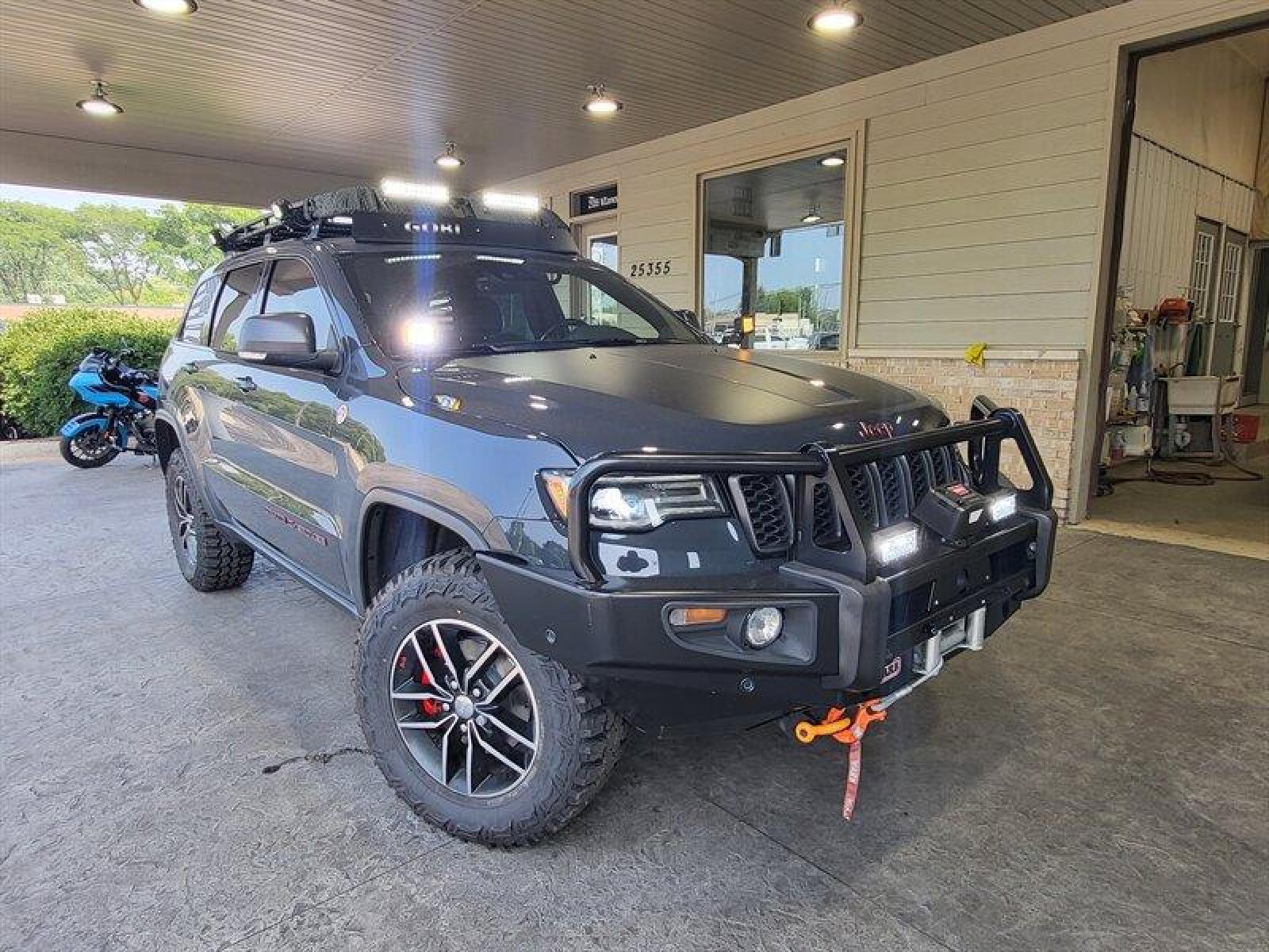 2018 Granite Crystal Metallic Clear Coat Jeep Grand Cherokee Trailhawk (1C4RJFLG3JC) with an Pentastar 3.6L V6 29 engine, Automatic transmission, located at 25355 Eames Street, Channahon, IL, 60410, (815) 467-1807, 41.429108, -88.228432 - ** WOW LOOK AT THIS JEEP, WELL OVER $7,000 IN UPGRADES. 6 MONKEYS TIRE SWING, GOBI STEALTH RACK AND LADDER, ARB COMBINATION BUMPER, WARN M8000 WINCH, PLUS MUCH MORE. 5 BRAND NEW TIRES AS WELL. ** If you're ready for a different, no hassle and pleasant car buying experience, then give us a chance! We - Photo #0