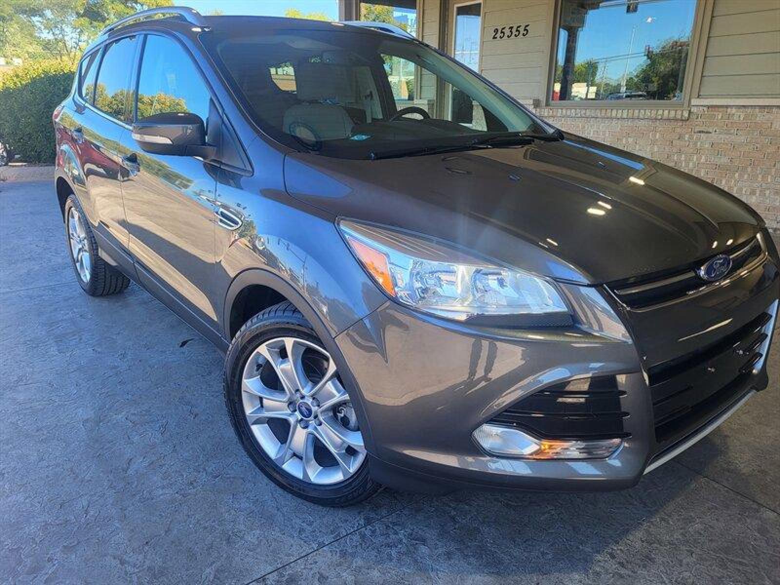2015 Magnetic Metallic Ford Escape Titanium (1FMCU0J9XFU) with an EcoBoost 2.0L Turbo I4 240hp 270ft. lbs. engine, Automatic transmission, located at 25355 Eames Street, Channahon, IL, 60410, (815) 467-1807, 41.429108, -88.228432 - CLEAN LOCAL TRADE! *CPO 3 MONTH/3,000 MILE WARRANTY INCLUDED* If you're ready for a different, no hassle and pleasant car buying experience, then give us a chance! We're breaking the standard Car Sales mold and making one of our very own you'll be sure to appreciate! So, why buy from Crase Auto Conn - Photo #0