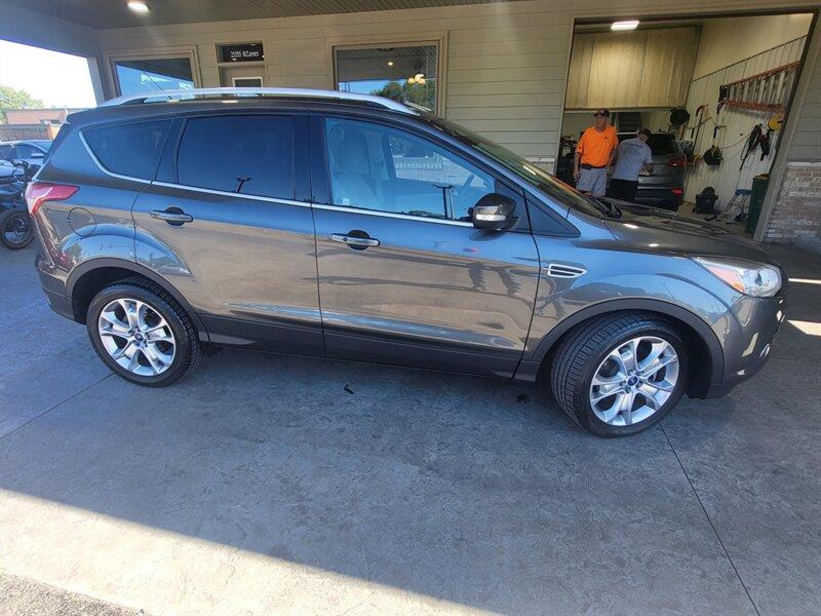 2015 Magnetic Metallic Ford Escape Titanium (1FMCU0J9XFU) with an EcoBoost 2.0L Turbo I4 240hp 270ft. lbs. engine, Automatic transmission, located at 25355 Eames Street, Channahon, IL, 60410, (815) 467-1807, 41.429108, -88.228432 - CLEAN LOCAL TRADE! *CPO 3 MONTH/3,000 MILE WARRANTY INCLUDED* If you're ready for a different, no hassle and pleasant car buying experience, then give us a chance! We're breaking the standard Car Sales mold and making one of our very own you'll be sure to appreciate! So, why buy from Crase Auto Conn - Photo #3