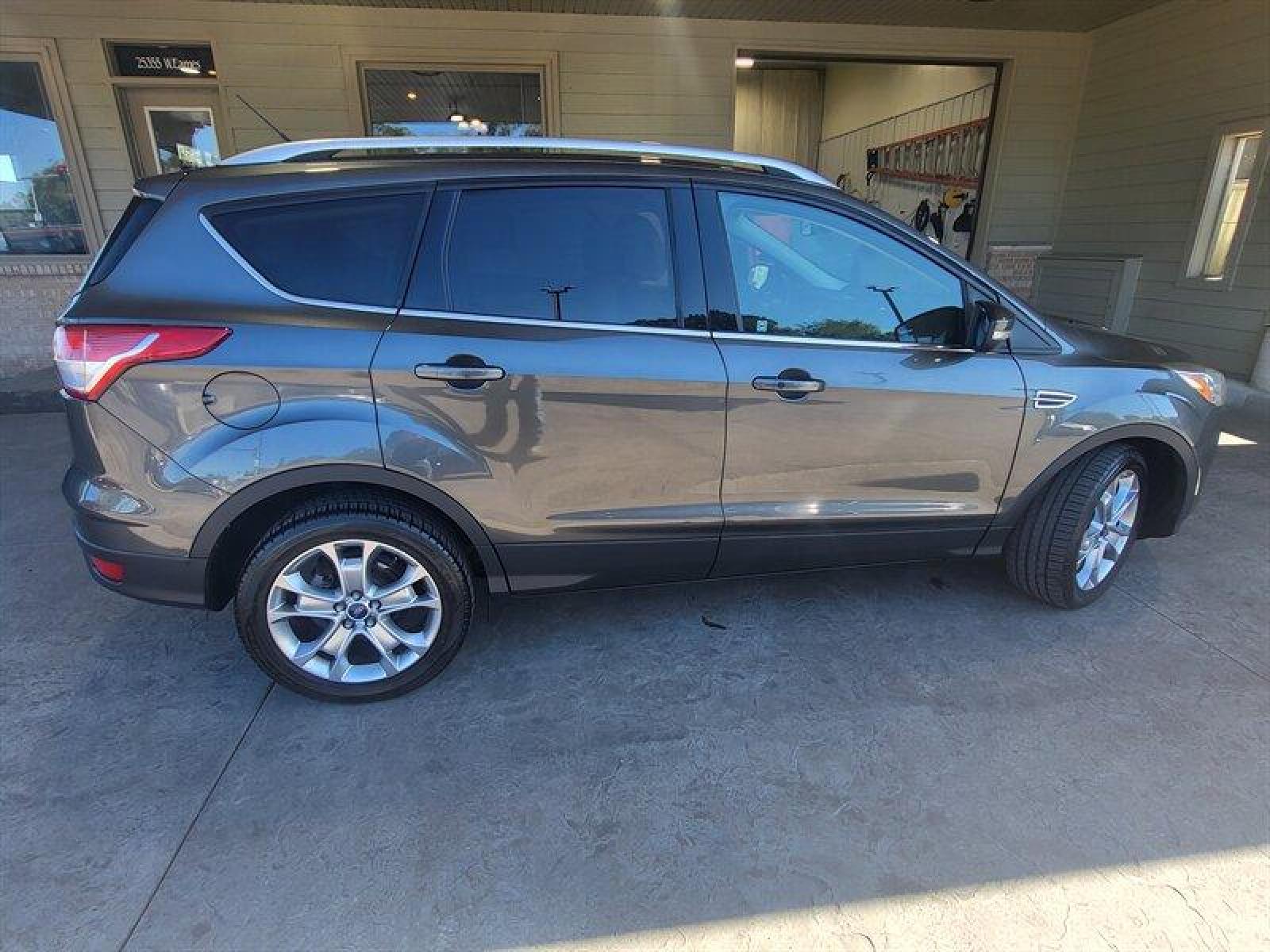2015 Magnetic Metallic Ford Escape Titanium (1FMCU0J9XFU) with an EcoBoost 2.0L Turbo I4 240hp 270ft. lbs. engine, Automatic transmission, located at 25355 Eames Street, Channahon, IL, 60410, (815) 467-1807, 41.429108, -88.228432 - CLEAN LOCAL TRADE! *CPO 3 MONTH/3,000 MILE WARRANTY INCLUDED* If you're ready for a different, no hassle and pleasant car buying experience, then give us a chance! We're breaking the standard Car Sales mold and making one of our very own you'll be sure to appreciate! So, why buy from Crase Auto Conn - Photo #5