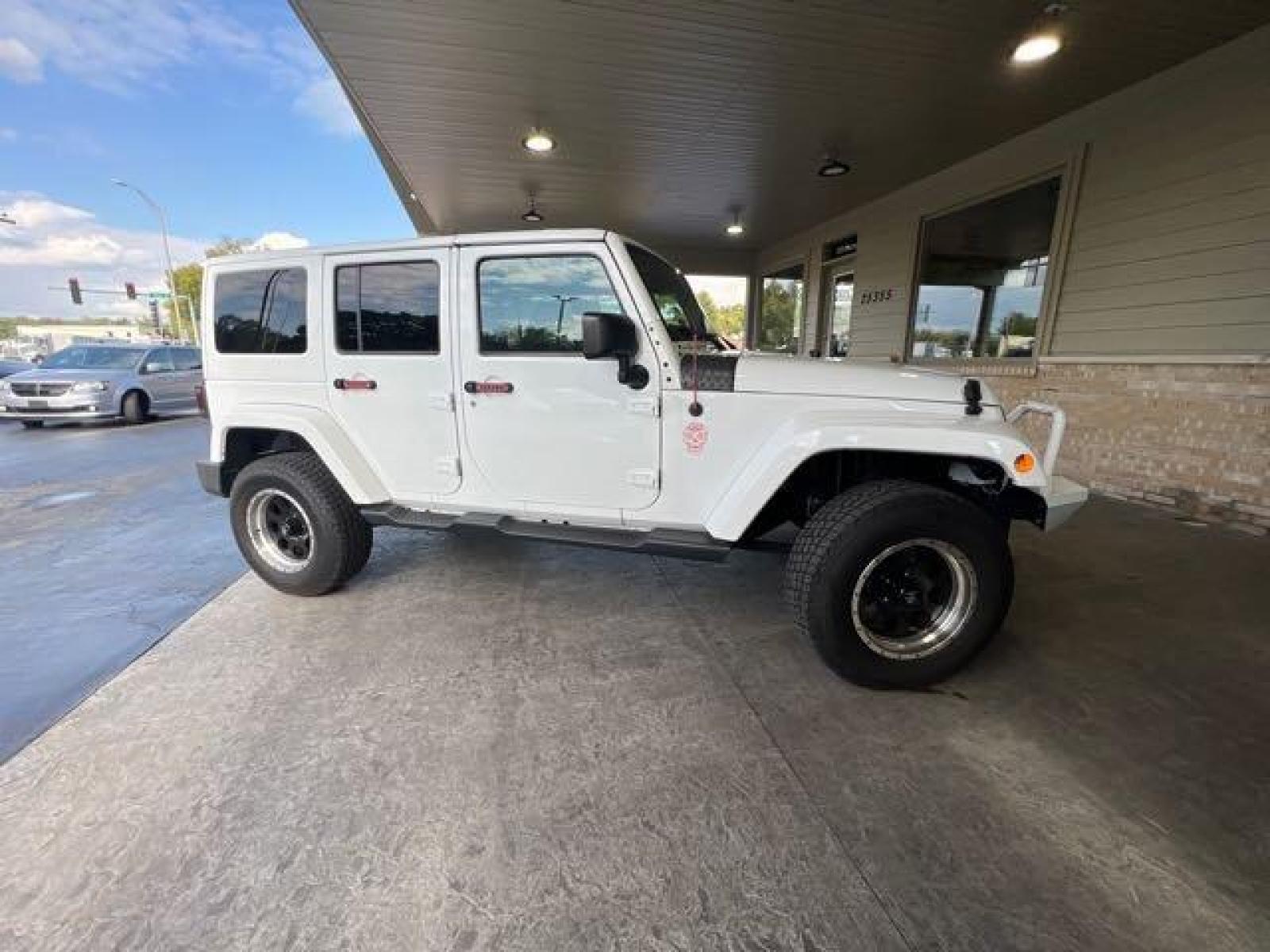 2017 Bright White Clear Coat Jeep Wrangler Unlimited Sahara (1C4HJWEG6HL) with an 3.6L V6 285hp 260ft. lbs. engine, Automatic transmission, located at 25355 Eames Street, Channahon, IL, 60410, (815) 467-1807, 41.429108, -88.228432 - CLEAN LOW MILE LOADED SAHARA! HEATED LEATHER! HARD TOP! If you're ready for a different, no hassle and pleasant car buying experience, then give us a chance! We're breaking the standard Car Sales mold and making one of our very own you'll be sure to appreciate! So, why buy from Crase Auto Connectio - Photo #2