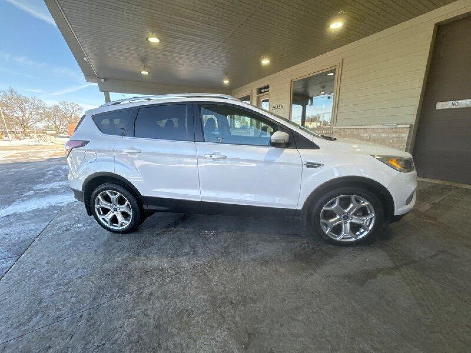 2017 White Platinum Metallic Tri-Coat Ford Escape Titanium (1FMCU9J91HU) with an EcoBoost 2.0L Turbo I4 245hp 275ft. lbs. engine, Automatic transmission, located at 25355 Eames Street, Channahon, IL, 60410, (815) 467-1807, 41.429108, -88.228432 - Looking for a ride that's turbo-charged and ready to go? Look no further than the 2017 Ford Escape Titanium! This baby is powered by an EcoBoost 2.0L Turbo I4 engine that's packing 245 horsepower and 275ft. lbs. of torque. That's right, you'll be flying down the highway with the wind in your hair an - Photo #1