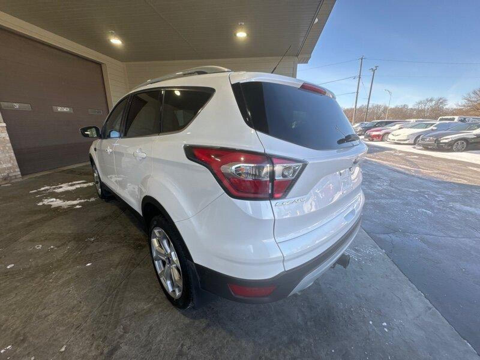 2017 White Platinum Metallic Tri-Coat Ford Escape Titanium (1FMCU9J91HU) with an EcoBoost 2.0L Turbo I4 245hp 275ft. lbs. engine, Automatic transmission, located at 25355 Eames Street, Channahon, IL, 60410, (815) 467-1807, 41.429108, -88.228432 - Looking for a ride that's turbo-charged and ready to go? Look no further than the 2017 Ford Escape Titanium! This baby is powered by an EcoBoost 2.0L Turbo I4 engine that's packing 245 horsepower and 275ft. lbs. of torque. That's right, you'll be flying down the highway with the wind in your hair an - Photo #6