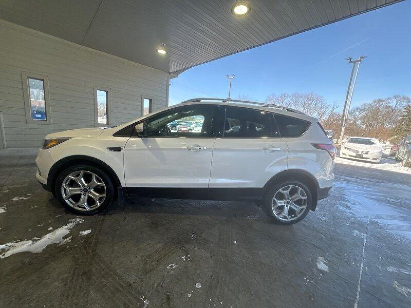 2017 White Platinum Metallic Tri-Coat Ford Escape Titanium (1FMCU9J91HU) with an EcoBoost 2.0L Turbo I4 245hp 275ft. lbs. engine, Automatic transmission, located at 25355 Eames Street, Channahon, IL, 60410, (815) 467-1807, 41.429108, -88.228432 - Looking for a ride that's turbo-charged and ready to go? Look no further than the 2017 Ford Escape Titanium! This baby is powered by an EcoBoost 2.0L Turbo I4 engine that's packing 245 horsepower and 275ft. lbs. of torque. That's right, you'll be flying down the highway with the wind in your hair an - Photo #7