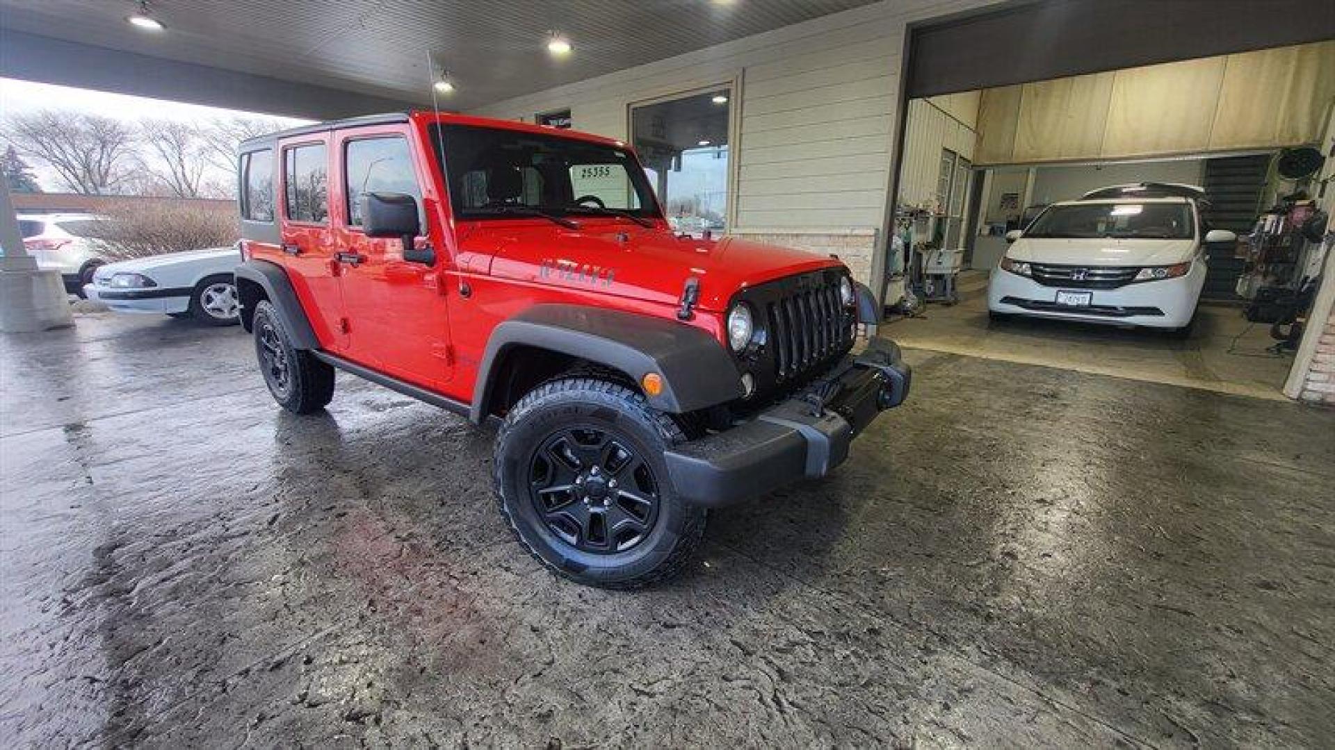 2017 Firecracker Red Clear Coat Jeep Wrangler Unlimited Willys (1C4BJWDG0HL) with an 3.6L V6 285hp 260ft. lbs. engine, Automatic transmission, located at 25355 Eames Street, Channahon, IL, 60410, (815) 467-1807, 41.429108, -88.228432 - Looking for a vehicle that's as rugged as you are? Look no further than the 2017 Jeep Wrangler Unlimited Sport! This beast is powered by a 3.6L V6 engine that delivers a whopping 285 horsepower and 260 foot-pounds of torque. That's enough power to make any other vehicle on the road look like a wimpy - Photo#0