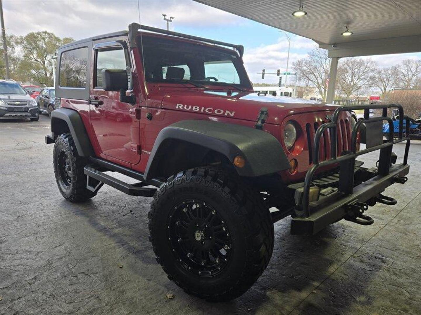 2007 Flame Red Clearcoat Jeep Wrangler Rubicon (1J8GA64197L) with an 3.8L V6 205hp 240ft. lbs. engine, 6 Speed Manual transmission, located at 25355 Eames Street, Channahon, IL, 60410, (815) 467-1807, 41.429108, -88.228432 - Photo#0