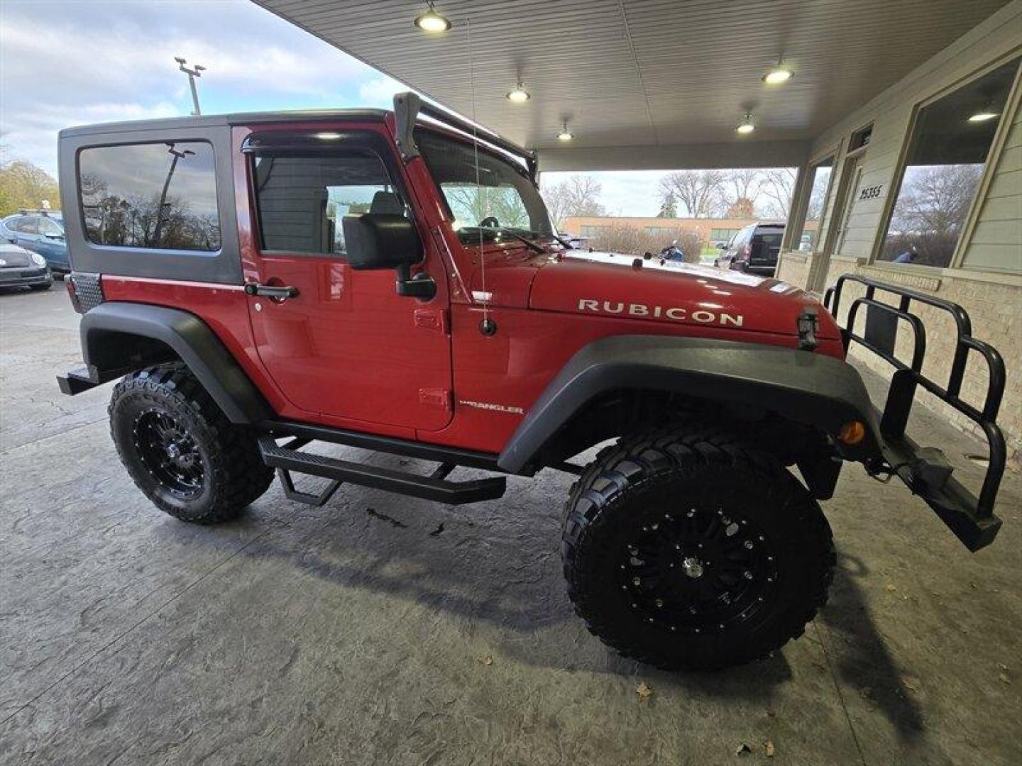 2007 Flame Red Clearcoat Jeep Wrangler Rubicon (1J8GA64197L) with an 3.8L V6 205hp 240ft. lbs. engine, 6 Speed Manual transmission, located at 25355 Eames Street, Channahon, IL, 60410, (815) 467-1807, 41.429108, -88.228432 - Photo#1