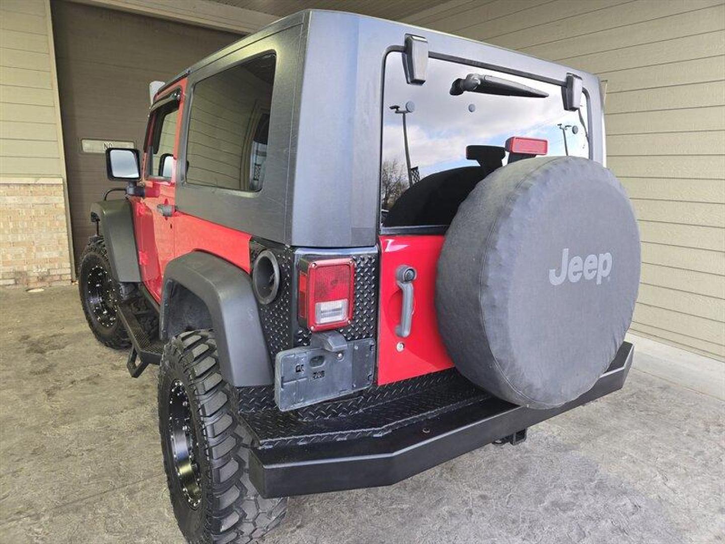 2007 Flame Red Clearcoat Jeep Wrangler Rubicon (1J8GA64197L) with an 3.8L V6 205hp 240ft. lbs. engine, 6 Speed Manual transmission, located at 25355 Eames Street, Channahon, IL, 60410, (815) 467-1807, 41.429108, -88.228432 - Photo#5