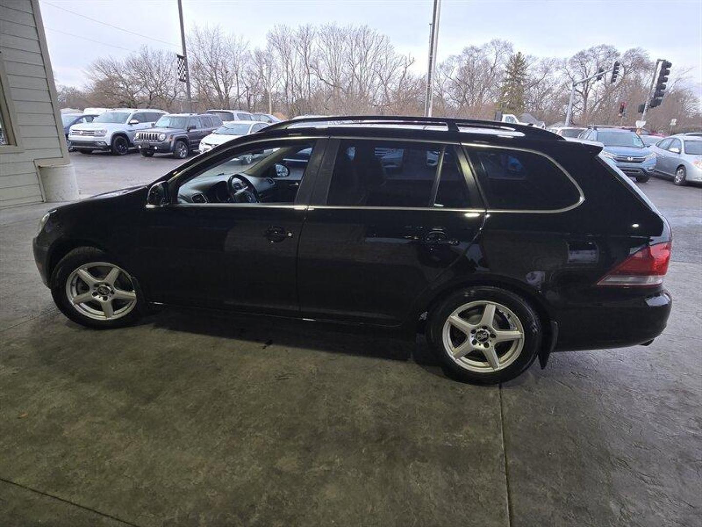 2014 Black Uni Volkswagen Jetta 2.0L TDI (3VWML7AJ4EM) with an 2.0L Diesel Turbo I4 140hp 236ft. lbs. engine, 6 Speed Manual transmission, located at 25355 Eames Street, Channahon, IL, 60410, (815) 467-1807, 41.429108, -88.228432 - Looking for a car that can tackle the daily grind without constantly stopping for gas? Look no further than the 2014 Volkswagen Jetta SportWagen TDI! With a powerful 2.0L Diesel Turbo I4 engine that cranks out 140 horses and 236 ft. lbs. of torque, you'll have all the power you need to zip through t - Photo#6