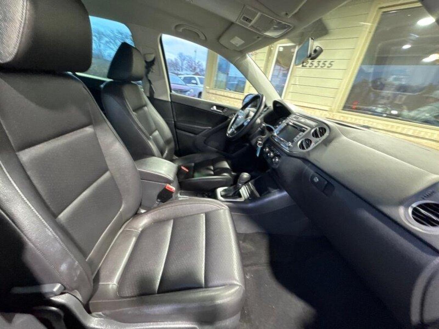 2012 Deep Black Metallic Volkswagen Tiguan S 4Motion (WVGBV7AX8CW) with an 2.0L I4 Turbo 200hp 207ft. lbs. engine, TipTronic transmission, located at 25355 Eames Street, Channahon, IL, 60410, (815) 467-1807, 41.429108, -88.228432 - Introducing the 2012 Volkswagen Tiguan S 4Motion! This baby is powered by a 2.0L I4 Turbo engine that pumps out a whopping 200 horsepower and 207 foot-pounds of torque. That's enough power to make you forget about that morning cup of coffee! But wait, there's more! This Tiguan has some sweet factor - Photo#16