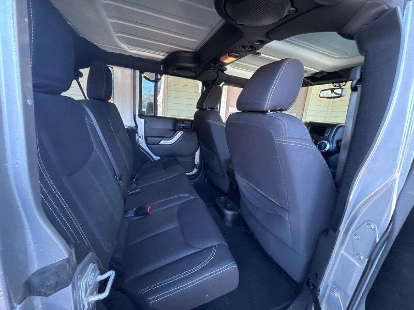 2014 Billet Silver Metallic Clear Coat Jeep Wrangler Unlimited Sahara (1C4BJWEG2EL) with an 3.6L V6 285hp 260ft. lbs. engine, Automatic transmission, located at 25355 Eames Street, Channahon, IL, 60410, (815) 467-1807, 41.429108, -88.228432 - Introducing the 2014 Jeep Wrangler Unlimited Sahara! This rugged and powerful SUV is ready for any adventure you can throw at it. Powered by a 3.6L V6 engine that produces 285 horsepower and 260 foot-pounds of torque, this Wrangler is built to handle any challenge. The exterior of this Wrangler is - Photo#13