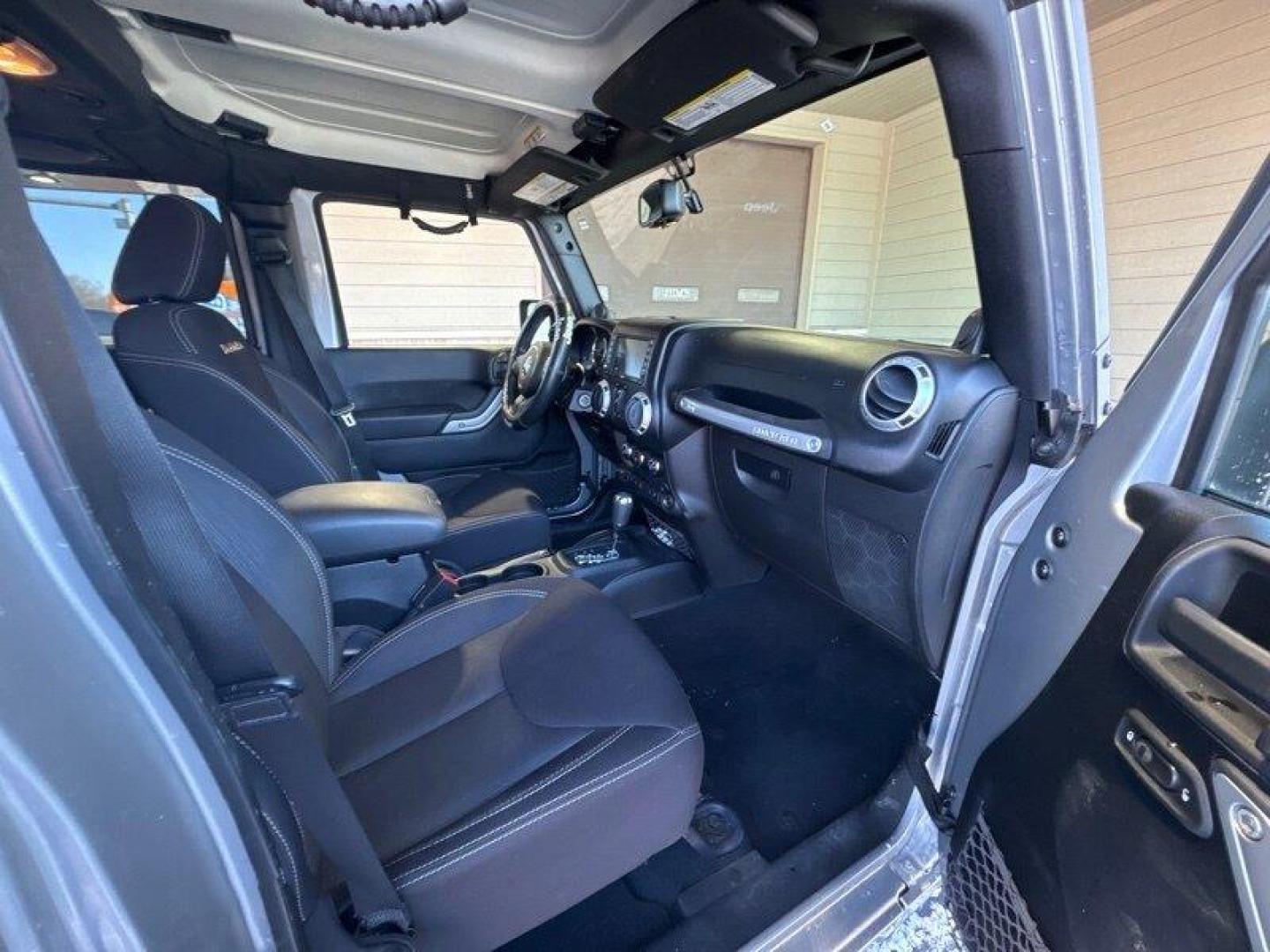 2014 Billet Silver Metallic Clear Coat Jeep Wrangler Unlimited Sahara (1C4BJWEG2EL) with an 3.6L V6 285hp 260ft. lbs. engine, Automatic transmission, located at 25355 Eames Street, Channahon, IL, 60410, (815) 467-1807, 41.429108, -88.228432 - Introducing the 2014 Jeep Wrangler Unlimited Sahara! This rugged and powerful SUV is ready for any adventure you can throw at it. Powered by a 3.6L V6 engine that produces 285 horsepower and 260 foot-pounds of torque, this Wrangler is built to handle any challenge. The exterior of this Wrangler is - Photo#14