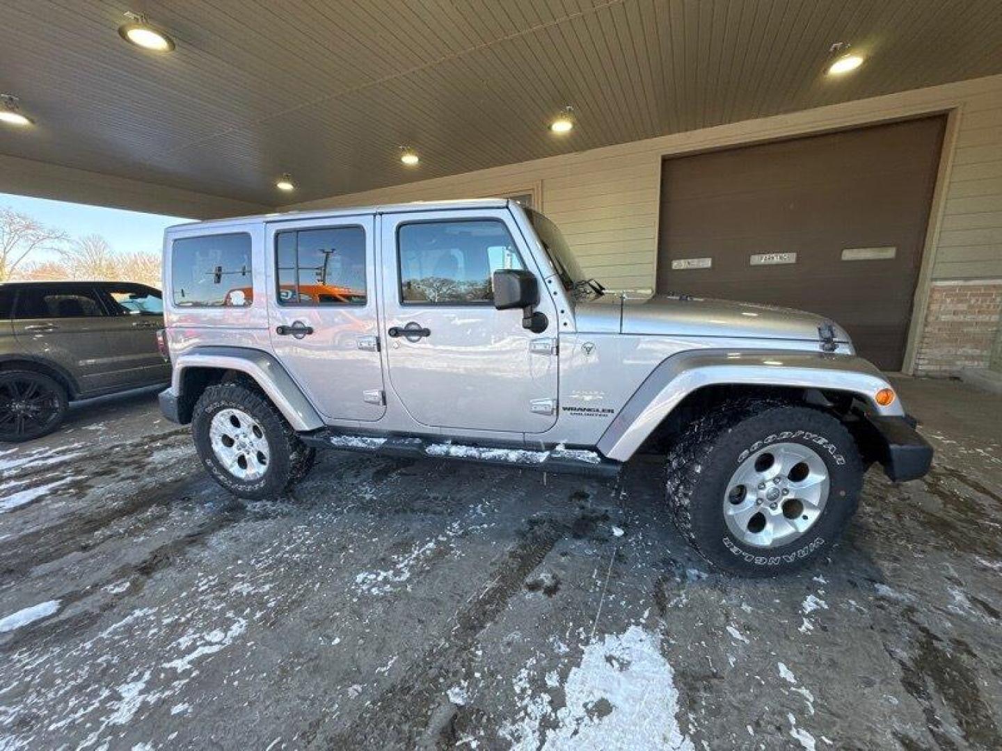 2014 Billet Silver Metallic Clear Coat Jeep Wrangler Unlimited Sahara (1C4BJWEG2EL) with an 3.6L V6 285hp 260ft. lbs. engine, Automatic transmission, located at 25355 Eames Street, Channahon, IL, 60410, (815) 467-1807, 41.429108, -88.228432 - Introducing the 2014 Jeep Wrangler Unlimited Sahara! This rugged and powerful SUV is ready for any adventure you can throw at it. Powered by a 3.6L V6 engine that produces 285 horsepower and 260 foot-pounds of torque, this Wrangler is built to handle any challenge. The exterior of this Wrangler is - Photo#1