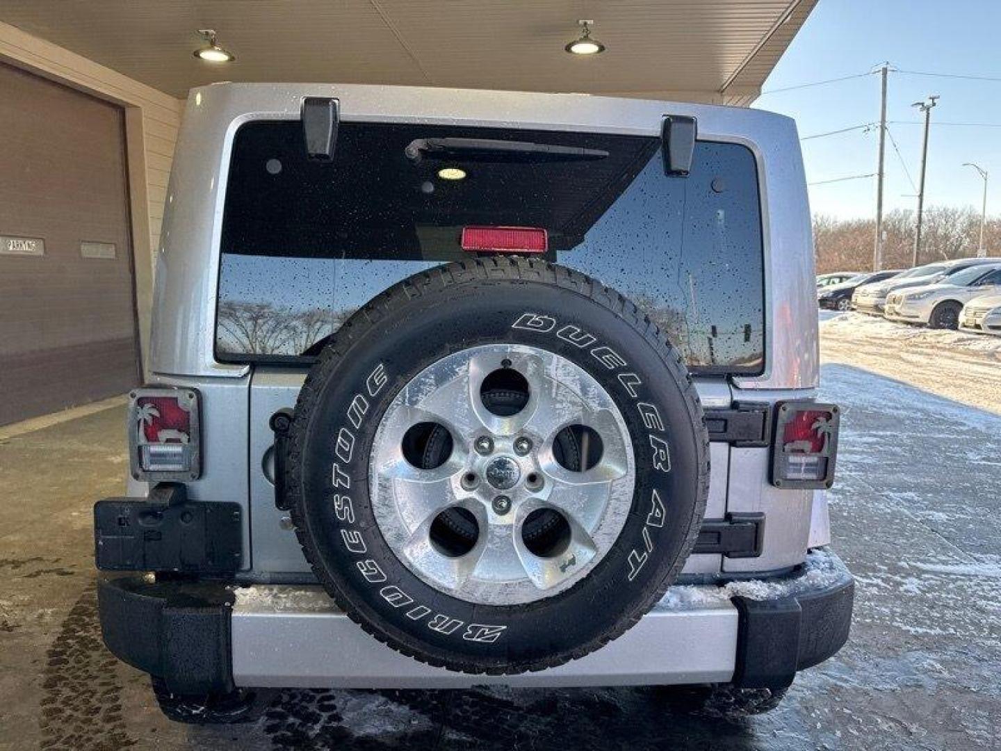2014 Billet Silver Metallic Clear Coat Jeep Wrangler Unlimited Sahara (1C4BJWEG2EL) with an 3.6L V6 285hp 260ft. lbs. engine, Automatic transmission, located at 25355 Eames Street, Channahon, IL, 60410, (815) 467-1807, 41.429108, -88.228432 - Introducing the 2014 Jeep Wrangler Unlimited Sahara! This rugged and powerful SUV is ready for any adventure you can throw at it. Powered by a 3.6L V6 engine that produces 285 horsepower and 260 foot-pounds of torque, this Wrangler is built to handle any challenge. The exterior of this Wrangler is - Photo#3