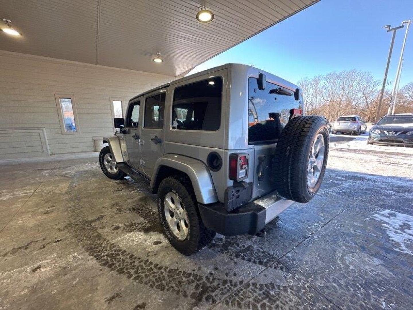 2014 Billet Silver Metallic Clear Coat Jeep Wrangler Unlimited Sahara (1C4BJWEG2EL) with an 3.6L V6 285hp 260ft. lbs. engine, Automatic transmission, located at 25355 Eames Street, Channahon, IL, 60410, (815) 467-1807, 41.429108, -88.228432 - Introducing the 2014 Jeep Wrangler Unlimited Sahara! This rugged and powerful SUV is ready for any adventure you can throw at it. Powered by a 3.6L V6 engine that produces 285 horsepower and 260 foot-pounds of torque, this Wrangler is built to handle any challenge. The exterior of this Wrangler is - Photo#4