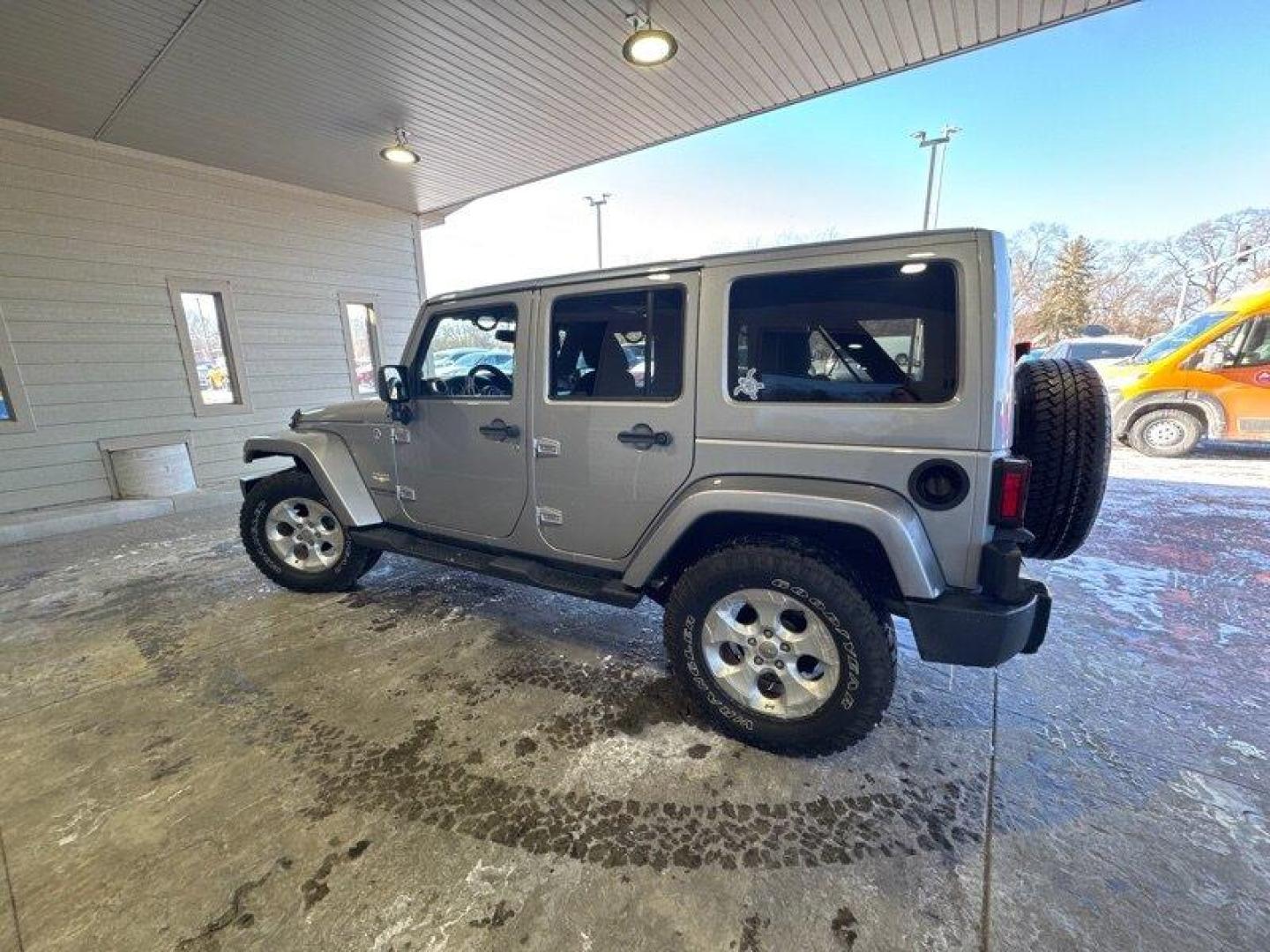 2014 Billet Silver Metallic Clear Coat Jeep Wrangler Unlimited Sahara (1C4BJWEG2EL) with an 3.6L V6 285hp 260ft. lbs. engine, Automatic transmission, located at 25355 Eames Street, Channahon, IL, 60410, (815) 467-1807, 41.429108, -88.228432 - Introducing the 2014 Jeep Wrangler Unlimited Sahara! This rugged and powerful SUV is ready for any adventure you can throw at it. Powered by a 3.6L V6 engine that produces 285 horsepower and 260 foot-pounds of torque, this Wrangler is built to handle any challenge. The exterior of this Wrangler is - Photo#5