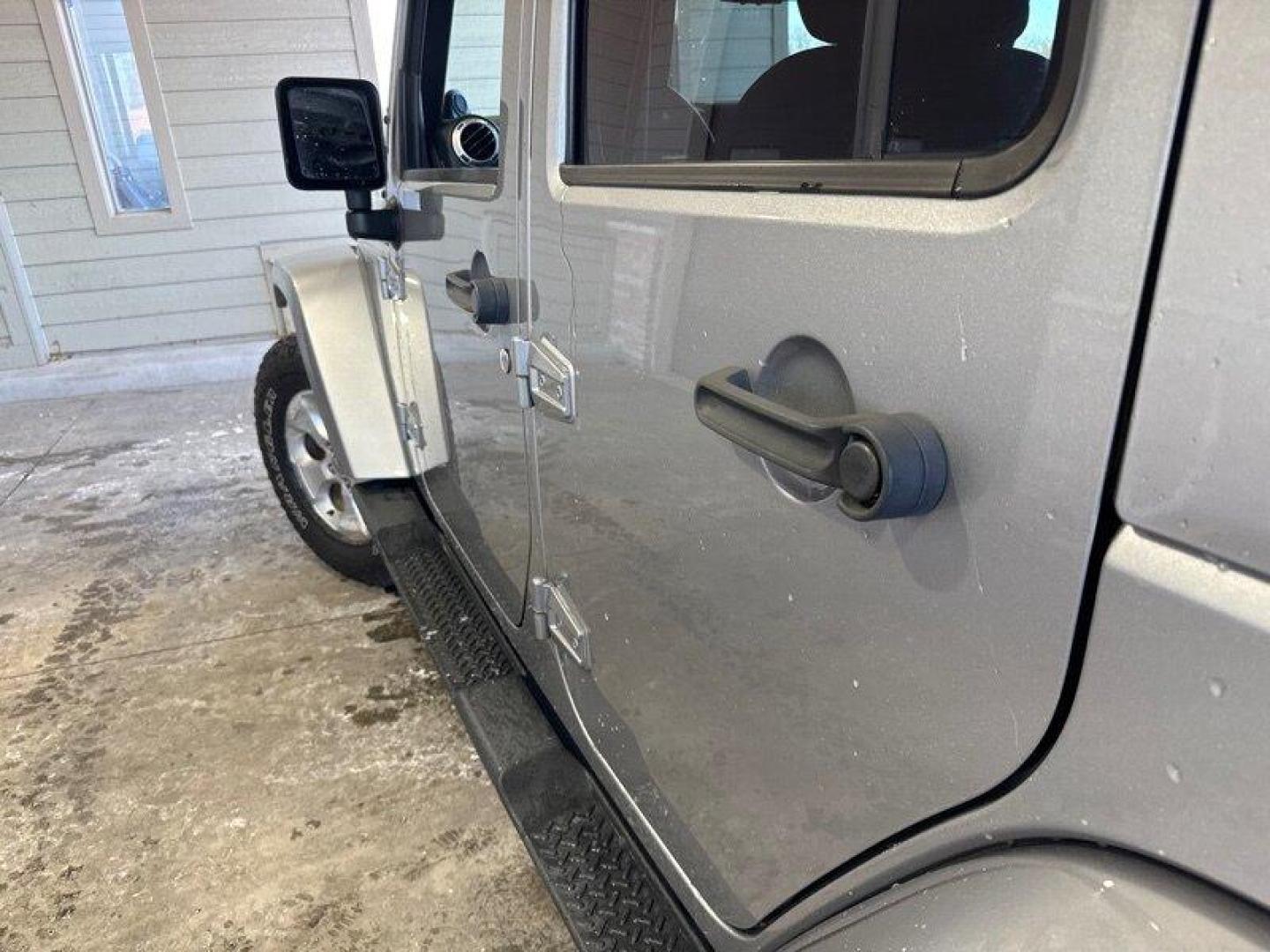 2014 Billet Silver Metallic Clear Coat Jeep Wrangler Unlimited Sahara (1C4BJWEG2EL) with an 3.6L V6 285hp 260ft. lbs. engine, Automatic transmission, located at 25355 Eames Street, Channahon, IL, 60410, (815) 467-1807, 41.429108, -88.228432 - Introducing the 2014 Jeep Wrangler Unlimited Sahara! This rugged and powerful SUV is ready for any adventure you can throw at it. Powered by a 3.6L V6 engine that produces 285 horsepower and 260 foot-pounds of torque, this Wrangler is built to handle any challenge. The exterior of this Wrangler is - Photo#8