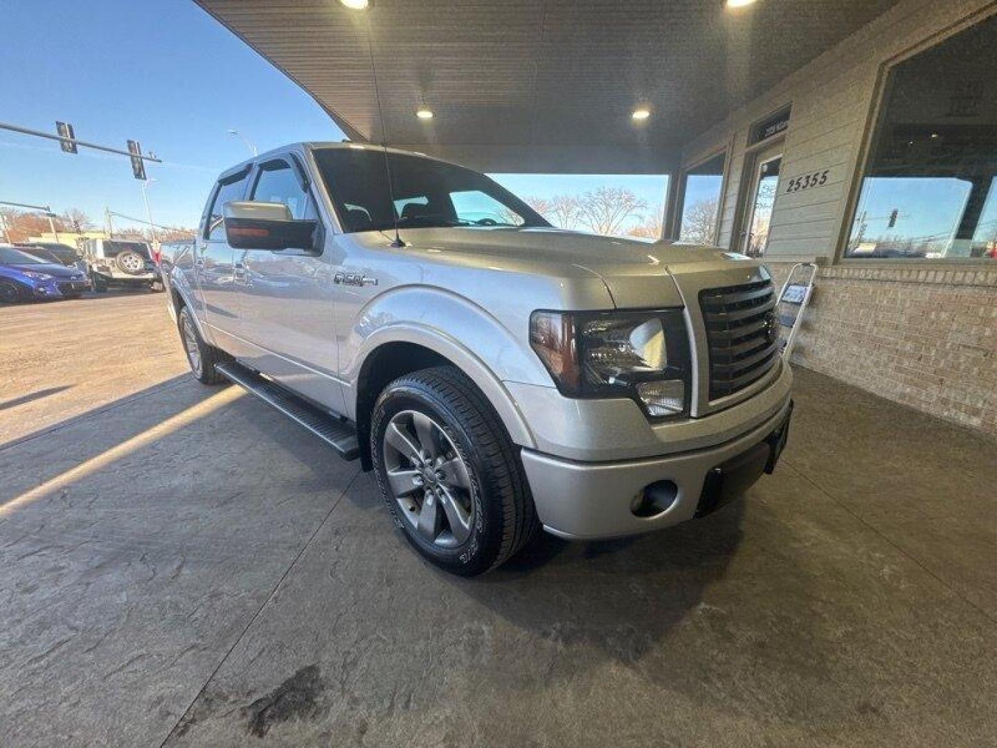 2012 Ingot Silver Metallic Ford F-150 FX2 (1FTFW1CF8CF) with an 5.0L Flex Fuel V8 360hp 380ft. lbs. engine, Automatic transmission, located at 25355 Eames Street, Channahon, IL, 60410, (815) 467-1807, 41.429108, -88.228432 - Oh honey, let me tell you about the 2012 Ford F-150 FX2. This baby is a powerhouse with a 5.0L Flex Fuel V8 engine, giving you a whopping 360 horsepower and 380 ft. lbs. of torque. And let's not forget about the FX Appearance Package that comes standard, making heads turn wherever you go. But wait - Photo#0