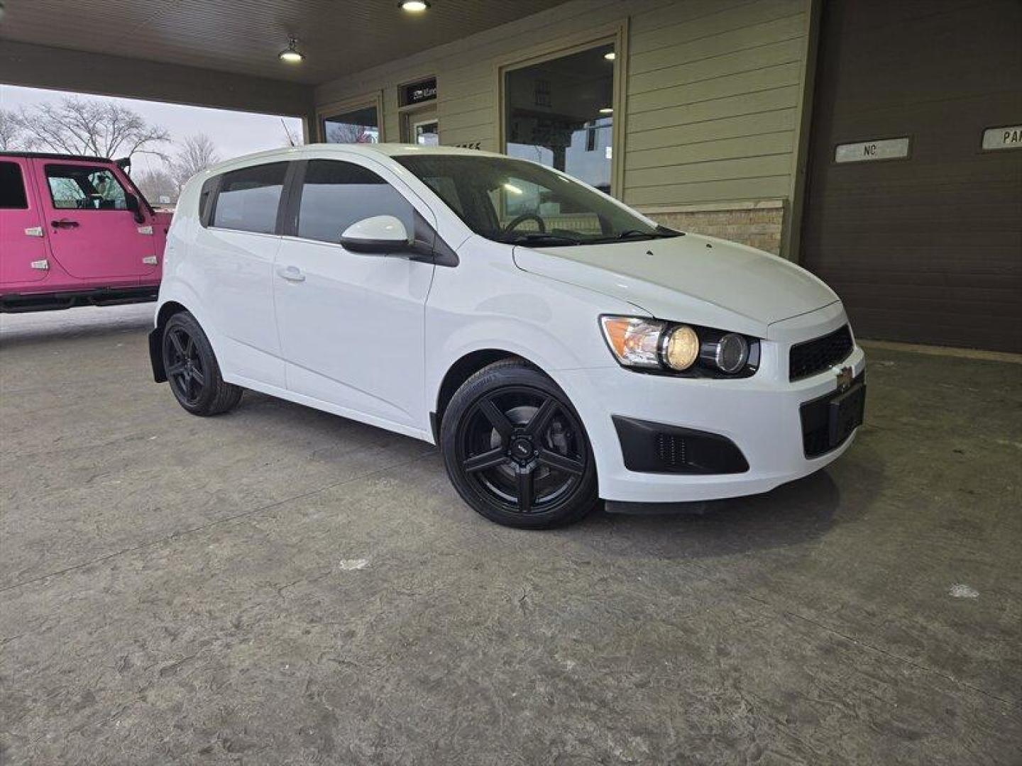 2013 Summit White Chevrolet Sonic LT (1G1JC6SB7D4) with an Ecotec 1.4L Turbo I4 138hp 148ft. lbs. engine, 6Speed Shiftable Au transmission, located at 25355 Eames Street, Channahon, IL, 60410, (815) 467-1807, 41.429108, -88.228432 - Introducing the 2013 Chevrolet Sonic LT Auto, a vehicle that exudes style, performance, and efficiency. With a powerful Ecotec 1.4L Turbo I4 138hp 148ft. lbs. engine under the hood, this car is sure to impress even the most discerning drivers. Step inside the cabin and you'll be greeted by a slew - Photo#0