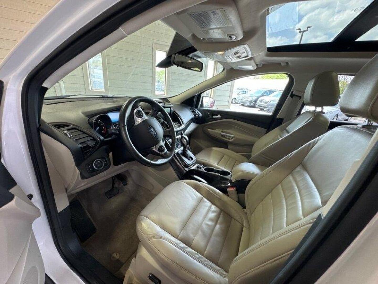 2016 White Platinum Metallic Tri-Coat Ford Escape Titanium (1FMCU9JX1GU) with an EcoBoost 1.6L Turbo I4 178hp 184ft. lbs. engine, 6-Speed Shiftable Au transmission, located at 25355 Eames Street, Channahon, IL, 60410, (815) 467-1807, 41.429108, -88.228432 - Step into the lap of luxury with this 2016 Ford Escape Titanium in a dazzling White Platinum Metallic Tri-Coat exterior and a cozy Medium Light Stone interior that screams sophistication. Powered by an impressive EcoBoost 1.6L Turbo I4 engine, this beauty boasts a respectable 178hp and 184ft. lbs. o - Photo#12