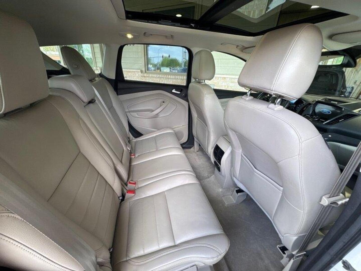 2016 White Platinum Metallic Tri-Coat Ford Escape Titanium (1FMCU9JX1GU) with an EcoBoost 1.6L Turbo I4 178hp 184ft. lbs. engine, 6-Speed Shiftable Au transmission, located at 25355 Eames Street, Channahon, IL, 60410, (815) 467-1807, 41.429108, -88.228432 - Step into the lap of luxury with this 2016 Ford Escape Titanium in a dazzling White Platinum Metallic Tri-Coat exterior and a cozy Medium Light Stone interior that screams sophistication. Powered by an impressive EcoBoost 1.6L Turbo I4 engine, this beauty boasts a respectable 178hp and 184ft. lbs. o - Photo#15
