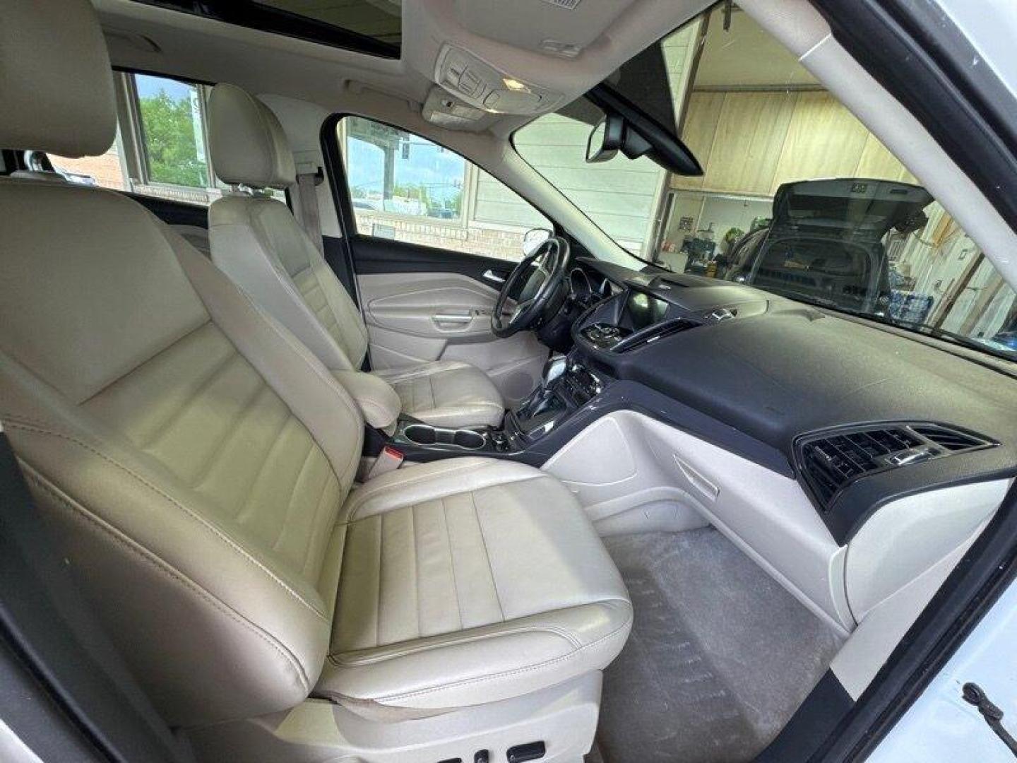 2016 White Platinum Metallic Tri-Coat Ford Escape Titanium (1FMCU9JX1GU) with an EcoBoost 1.6L Turbo I4 178hp 184ft. lbs. engine, 6-Speed Shiftable Au transmission, located at 25355 Eames Street, Channahon, IL, 60410, (815) 467-1807, 41.429108, -88.228432 - Step into the lap of luxury with this 2016 Ford Escape Titanium in a dazzling White Platinum Metallic Tri-Coat exterior and a cozy Medium Light Stone interior that screams sophistication. Powered by an impressive EcoBoost 1.6L Turbo I4 engine, this beauty boasts a respectable 178hp and 184ft. lbs. o - Photo#16
