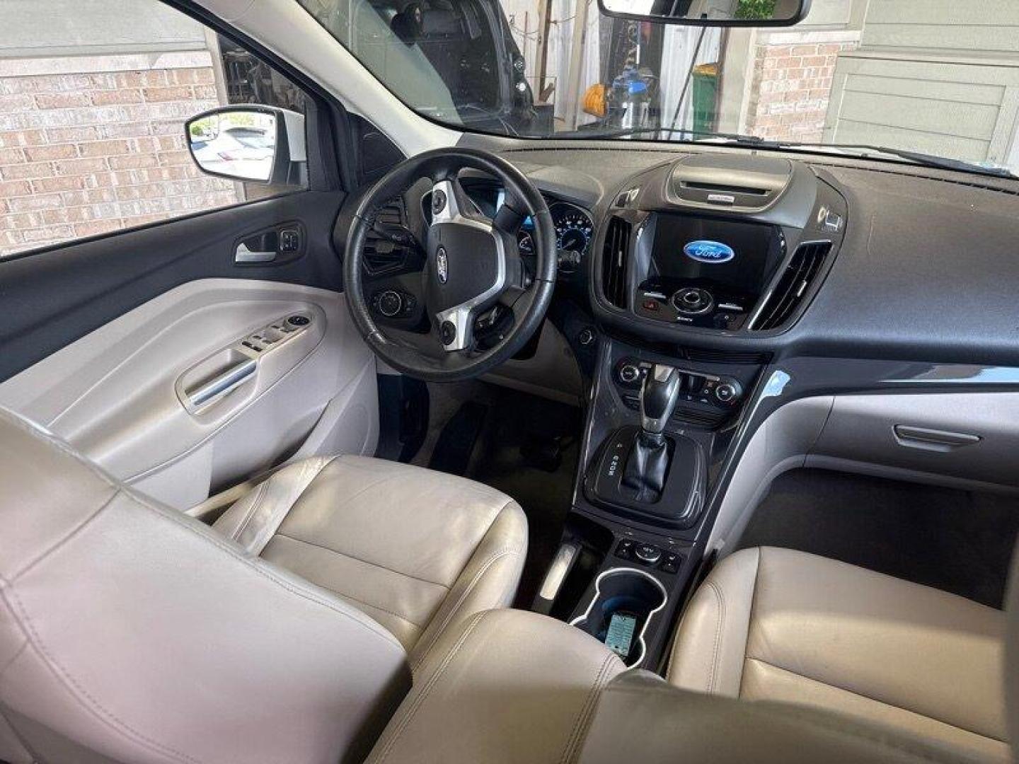 2016 White Platinum Metallic Tri-Coat Ford Escape Titanium (1FMCU9JX1GU) with an EcoBoost 1.6L Turbo I4 178hp 184ft. lbs. engine, 6-Speed Shiftable Au transmission, located at 25355 Eames Street, Channahon, IL, 60410, (815) 467-1807, 41.429108, -88.228432 - Step into the lap of luxury with this 2016 Ford Escape Titanium in a dazzling White Platinum Metallic Tri-Coat exterior and a cozy Medium Light Stone interior that screams sophistication. Powered by an impressive EcoBoost 1.6L Turbo I4 engine, this beauty boasts a respectable 178hp and 184ft. lbs. o - Photo#17