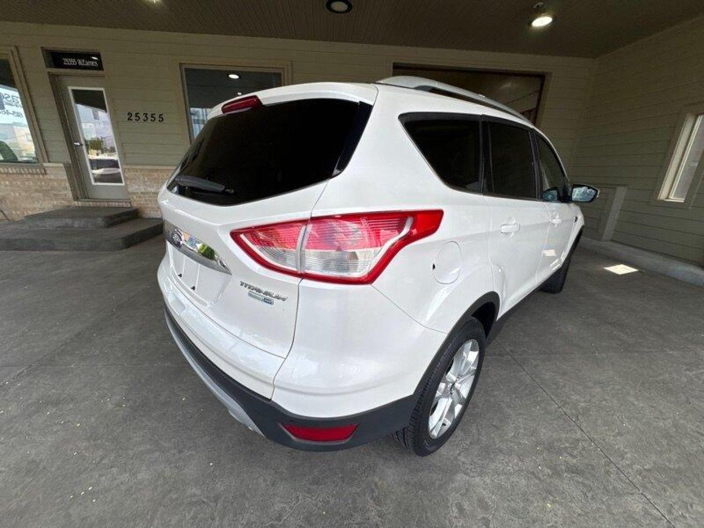 2016 White Platinum Metallic Tri-Coat Ford Escape Titanium (1FMCU9JX1GU) with an EcoBoost 1.6L Turbo I4 178hp 184ft. lbs. engine, 6-Speed Shiftable Au transmission, located at 25355 Eames Street, Channahon, IL, 60410, (815) 467-1807, 41.429108, -88.228432 - Step into the lap of luxury with this 2016 Ford Escape Titanium in a dazzling White Platinum Metallic Tri-Coat exterior and a cozy Medium Light Stone interior that screams sophistication. Powered by an impressive EcoBoost 1.6L Turbo I4 engine, this beauty boasts a respectable 178hp and 184ft. lbs. o - Photo#3