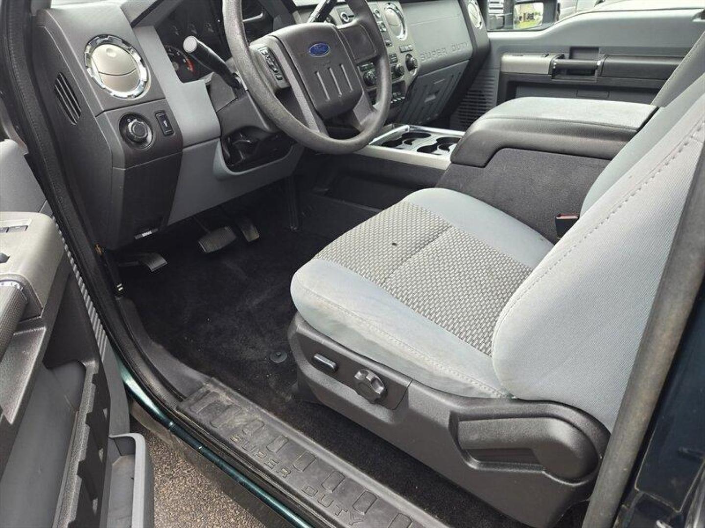 2012 Green Gem Metallic Ford F-250 XLT (1FT7X2B6XCE) with an 6.2L Flex Fuel V8 385hp 405ft. lbs. engine, Automatic transmission, located at 25355 Eames Street, Channahon, IL, 60410, (815) 467-1807, 41.429108, -88.228432 - ** TRADE IN WHOLESALE SPECIAL, HAS DAMAGE AND IS RUSTY BUT HAS LOW MILES AND NO WARNING LIGHTS ON THE DASH. SOLD AS-IS WE ARE NOT INSPECTING SO DO NOT KNOW WHAT IT MAY NEED MECHANICALLY. ** - Photo#2
