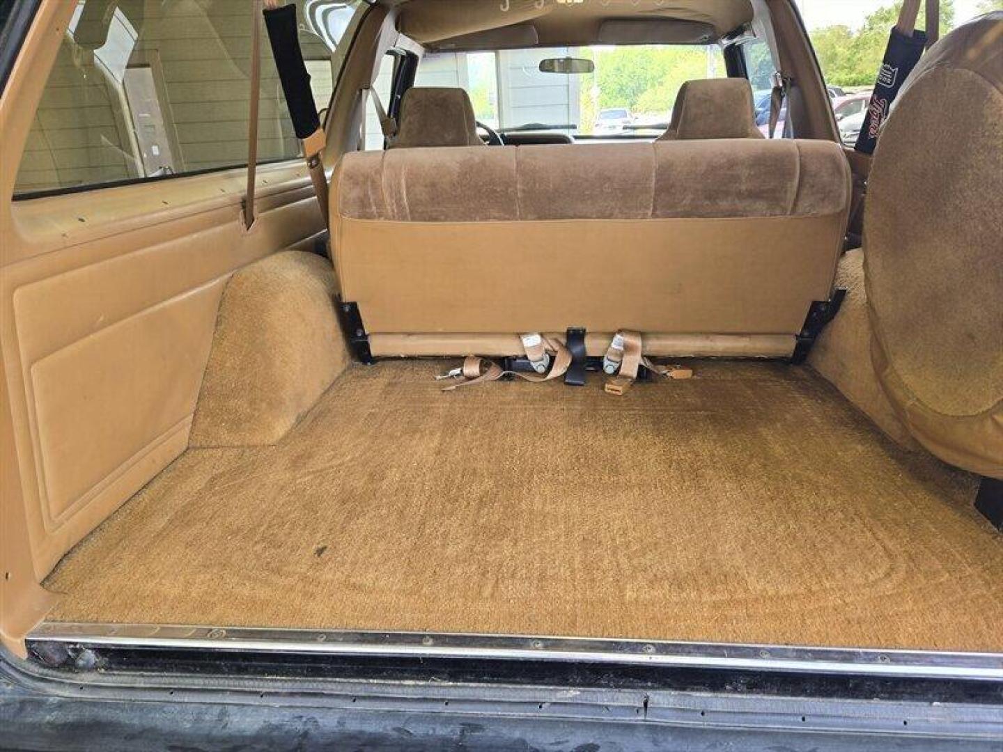 1992 Black Dodge Ramcharger CANYON SPORT (3B4GM17Z7NM) with an 5.9 engine, Automatic transmission, located at 25355 Eames Street, Channahon, IL, 60410, (815) 467-1807, 41.429108, -88.228432 - Presenting the 1992 Dodge Ramcharger CANYON SPORT. Equipped with a robust 5.9 engine, this classic vehicle boasts a range of factory default features that ensure a smooth and reliable driving experience. The exterior is finished in a sleek Black color, complemented by a warm Tan interior. With milea - Photo#24