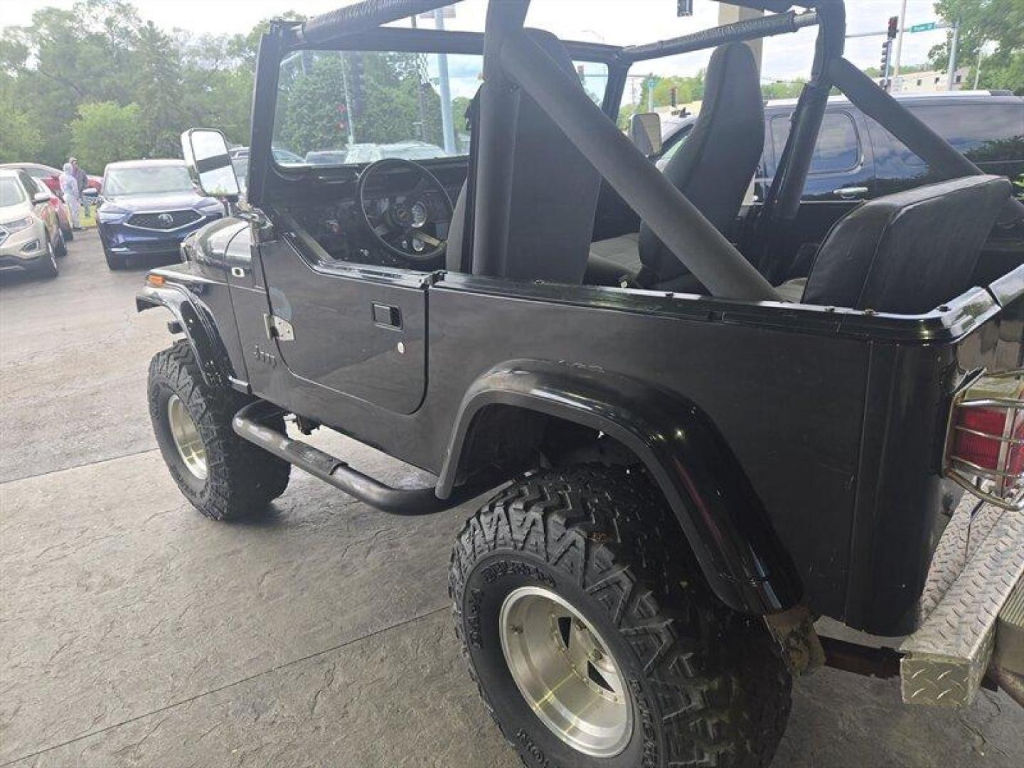 1984 Black Jeep CJ-7 2dr (1JCCM87E2ET) with an 4.2L I6 OHV 12V 2 BBL Engine engine, 4 Speed Manual transmission, located at 25355 Eames Street, Channahon, IL, 60410, (815) 467-1807, 41.429108, -88.228432 - ** V-8 MOTOR, JEEP COMMANDER FRAME, STARTS, RUNS, DRIVES, DOES NOT STEER DUE TO BENT STEERING COMPONENT. ** This 1984 Jeep CJ-7 2dr comes equipped with a robust 4.2L I6 OHV 12V 2 BBL Engine, offering reliable performance for any adventure. With remarkably low mileage, averaging less than 1,000 miles - Photo#1
