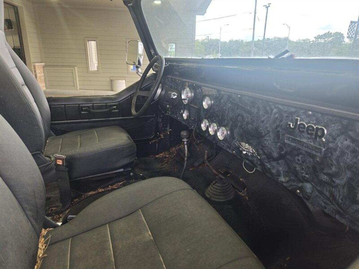 1984 Black Jeep CJ-7 2dr (1JCCM87E2ET) with an 4.2L I6 OHV 12V 2 BBL Engine engine, 4 Speed Manual transmission, located at 25355 Eames Street, Channahon, IL, 60410, (815) 467-1807, 41.429108, -88.228432 - ** V-8 MOTOR, JEEP COMMANDER FRAME, STARTS, RUNS, DRIVES, DOES NOT STEER DUE TO BENT STEERING COMPONENT. ** This 1984 Jeep CJ-7 2dr comes equipped with a robust 4.2L I6 OHV 12V 2 BBL Engine, offering reliable performance for any adventure. With remarkably low mileage, averaging less than 1,000 miles - Photo#4